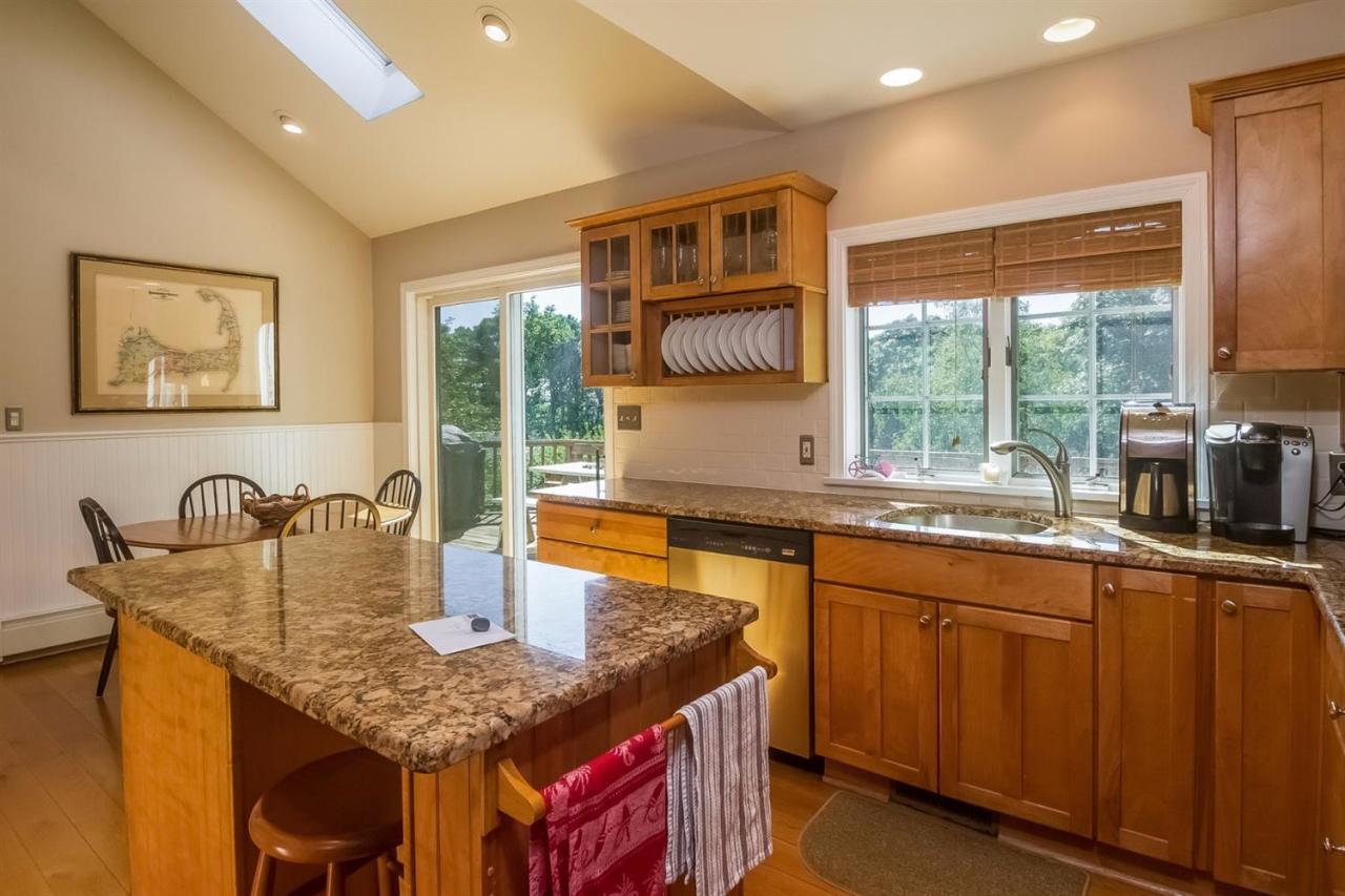 41 Harbor Hill Road Chatham, MA 02633 - Photo 10 of 35 a kitchen with stainless steel appliances granite countertop a sink a stove and a refrigerator