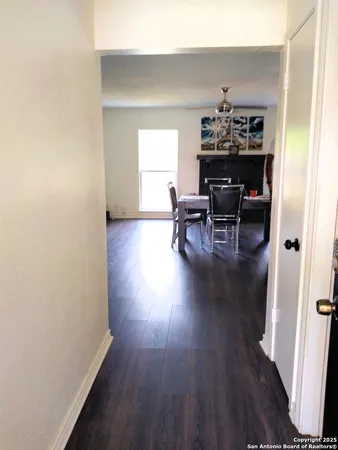 a view of livingroom and dining room with wooden floor and furniture
