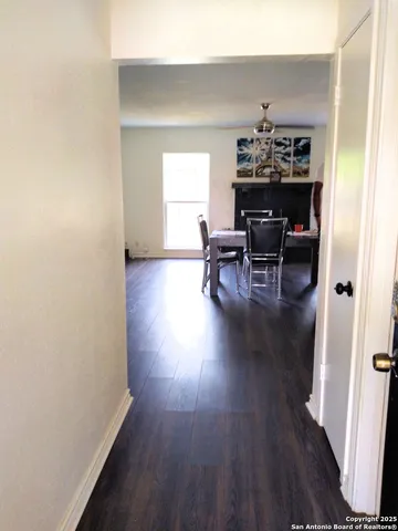 a view of livingroom and dining room with wooden floor and furniture