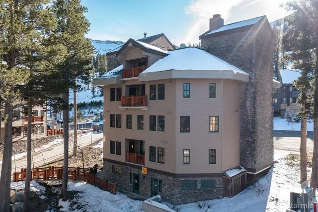 a view of a two chairs in the balcony