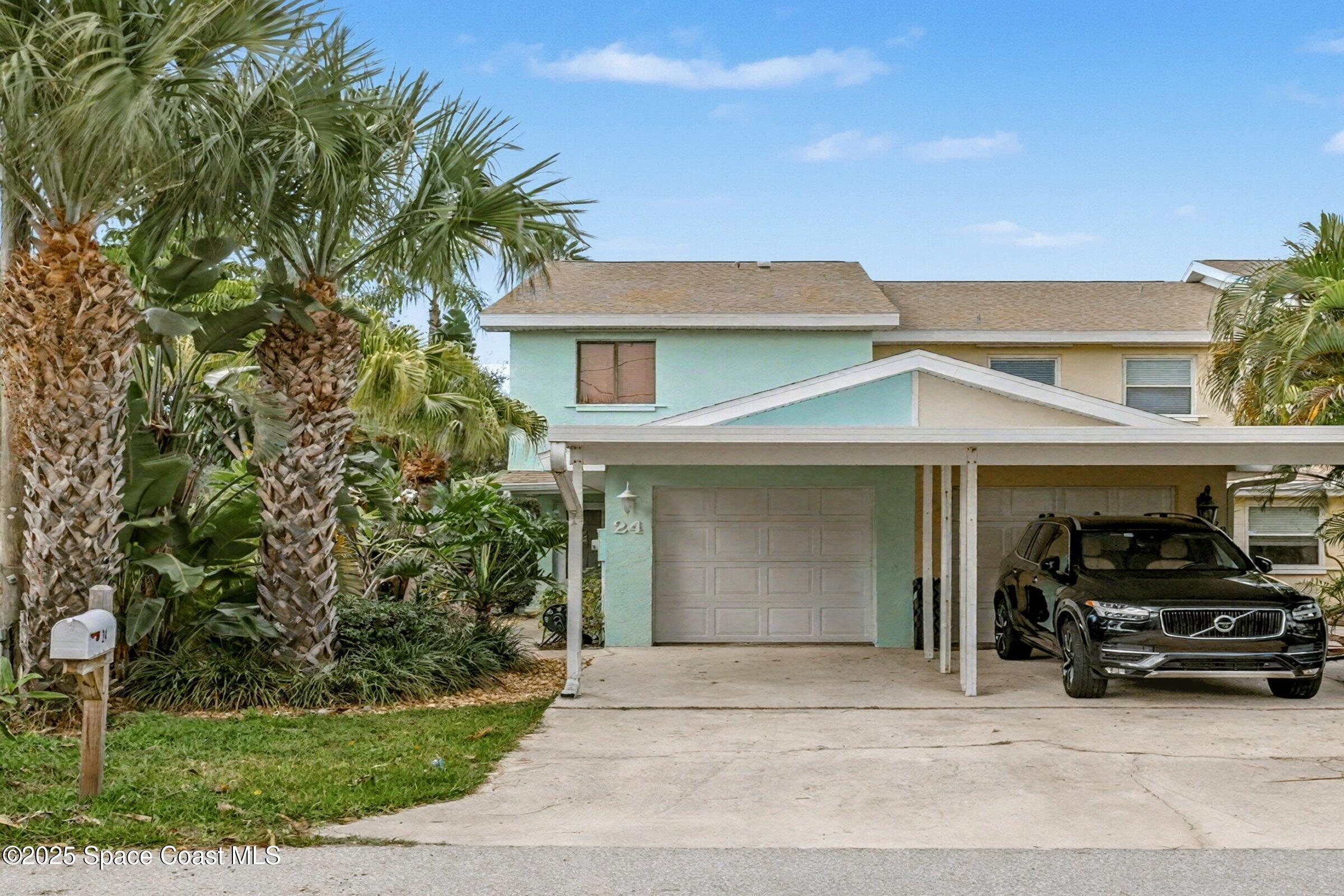 24 Olive Street Cocoa Beach, FL 32931 - Photo 1 of 50 a view of a car park in front of house