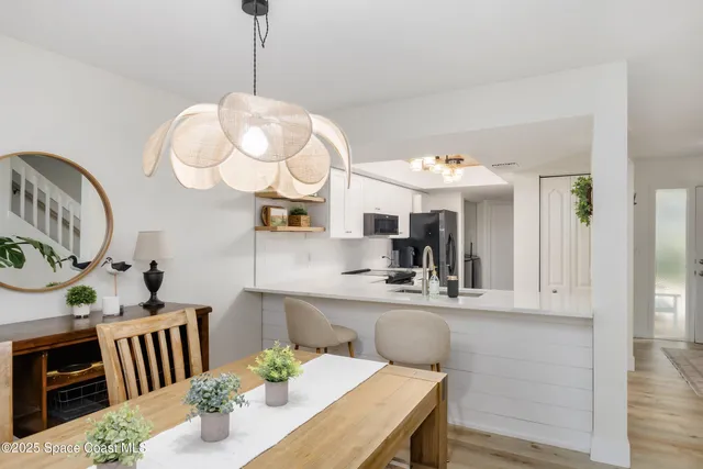 a view of kitchen and dining area with furniture