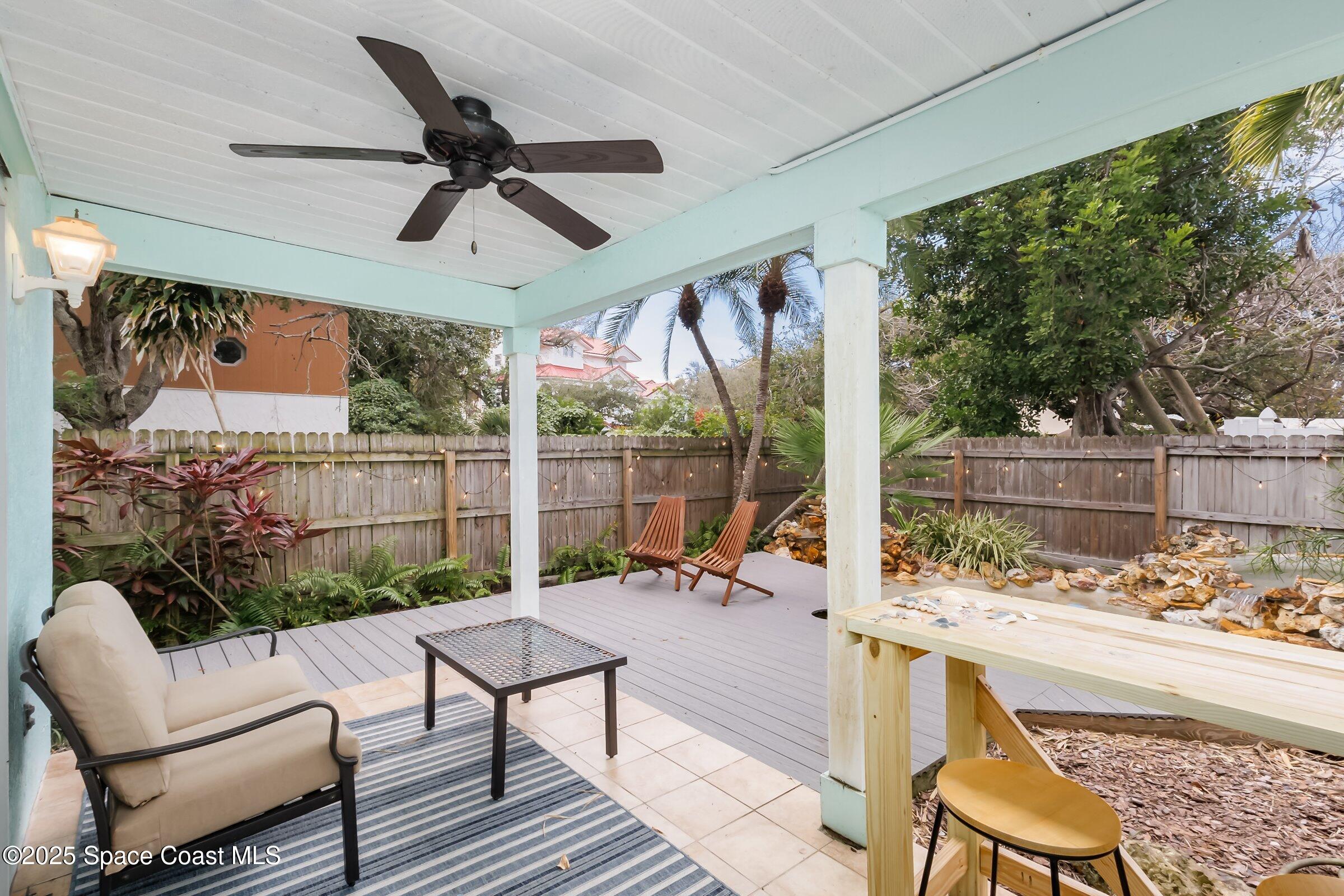 24 Olive Street Cocoa Beach, FL 32931 - Photo 18 of 50 a balcony with furniture and a large window