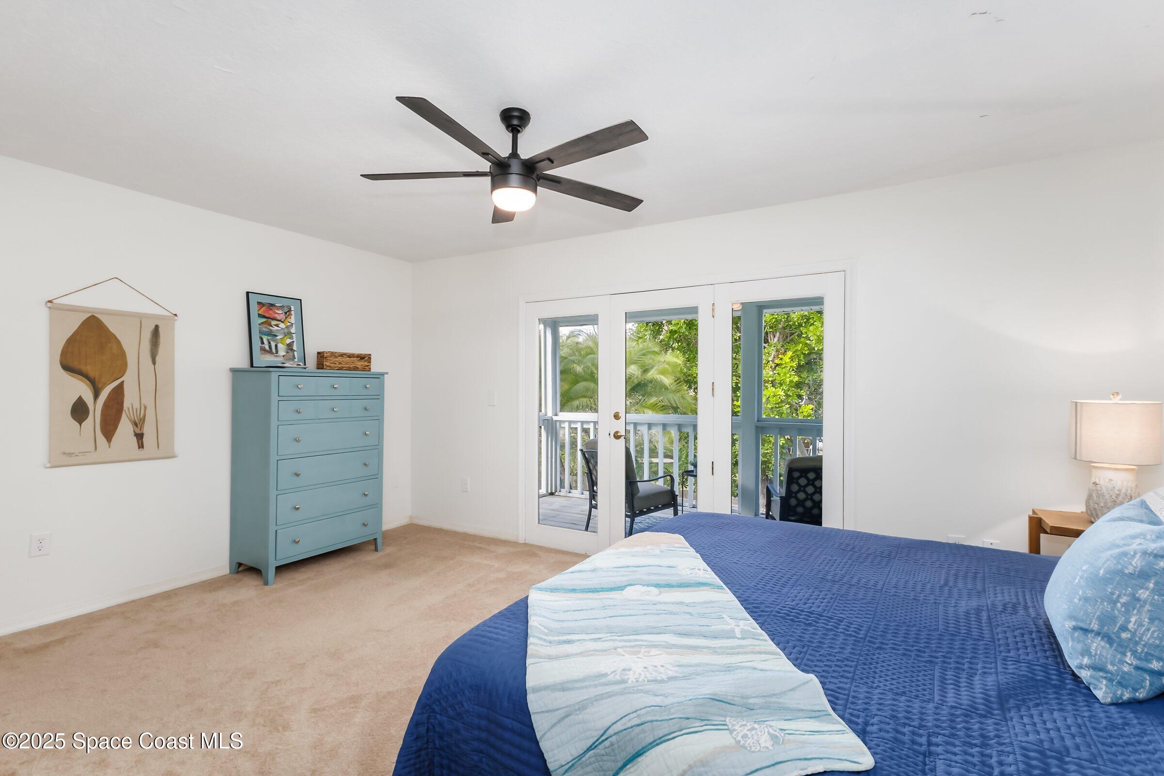 24 Olive Street Cocoa Beach, FL 32931 - Photo 24 of 50 a bed room with a bed and a window