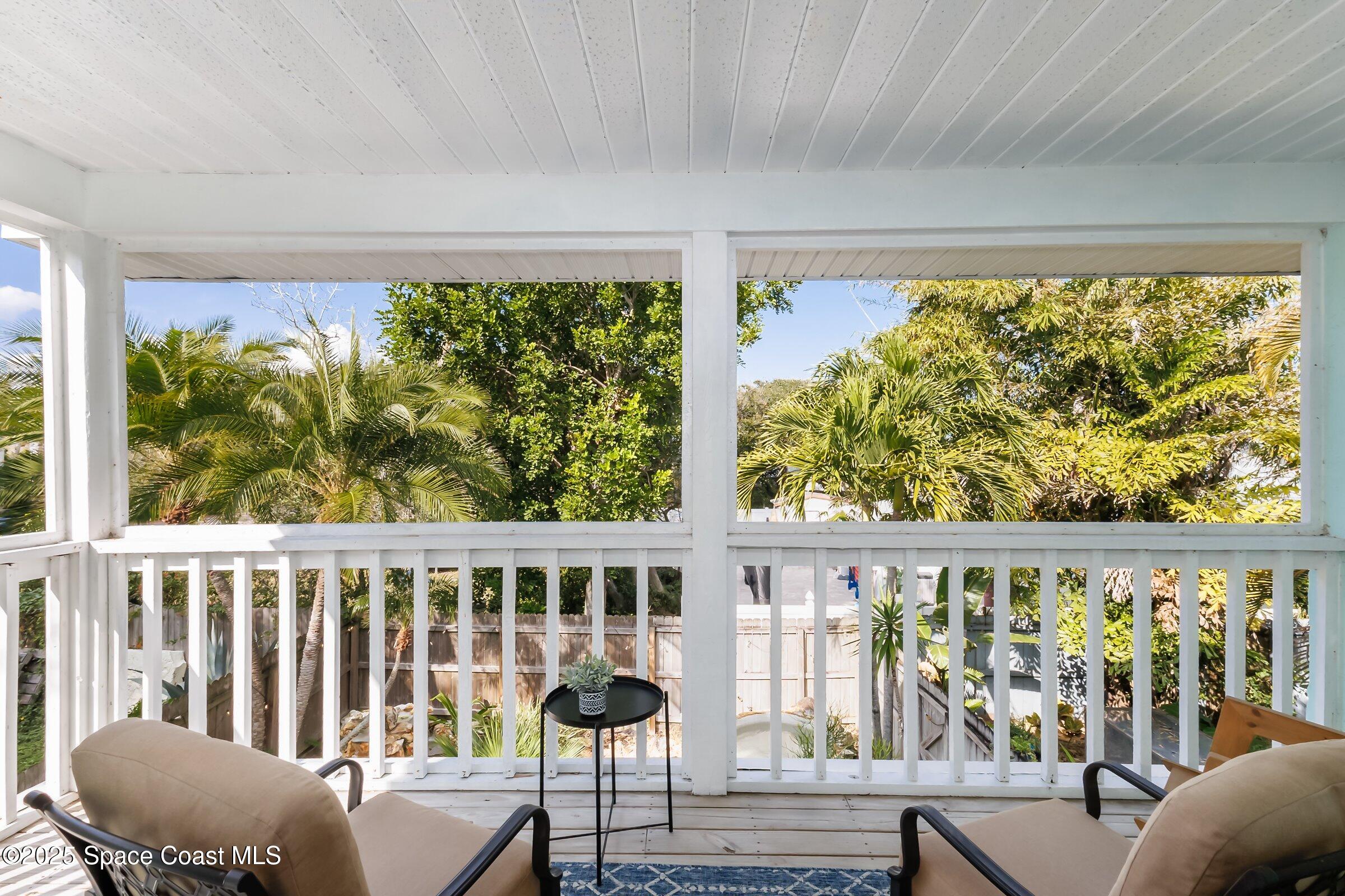 24 Olive Street Cocoa Beach, FL 32931 - Photo 30 of 50 a view of a porch with furniture and backyard