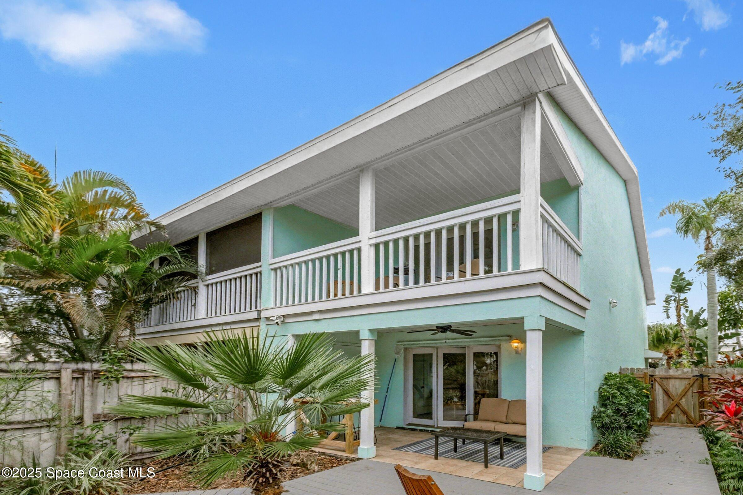 24 Olive Street Cocoa Beach, FL 32931 - Photo 32 of 50 a view of a house with a window and flower plants