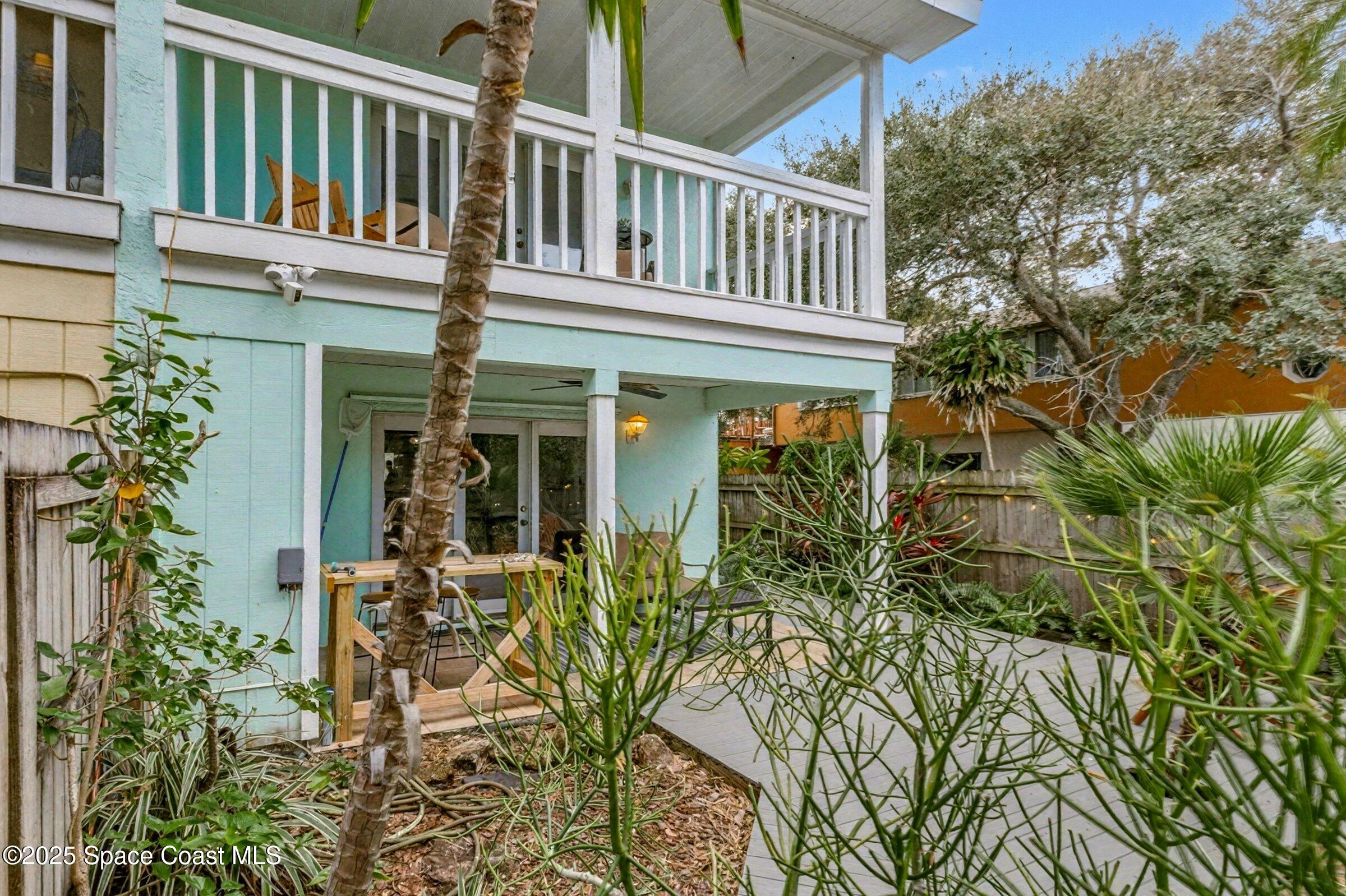 24 Olive Street Cocoa Beach, FL 32931 - Photo 34 of 50 a view of a house with a flower plants
