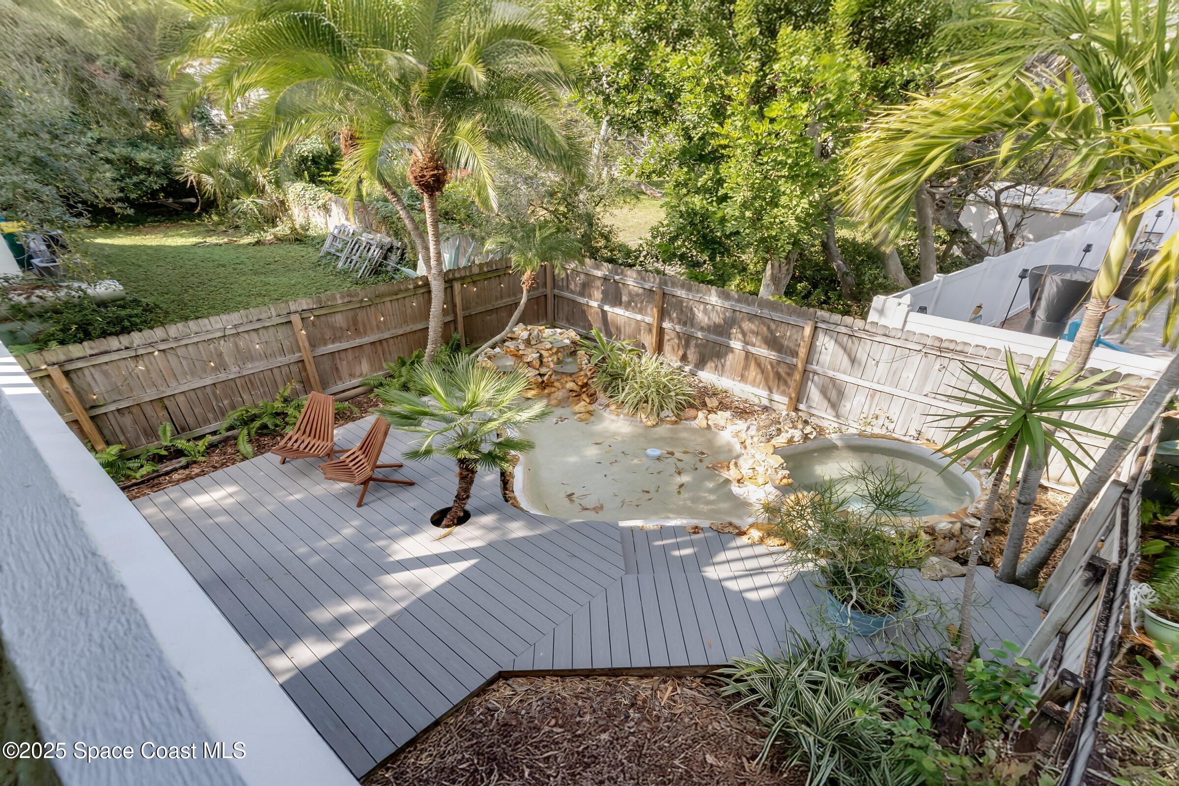 24 Olive Street Cocoa Beach, FL 32931 - Photo 36 of 50 a view of a house with a yard
