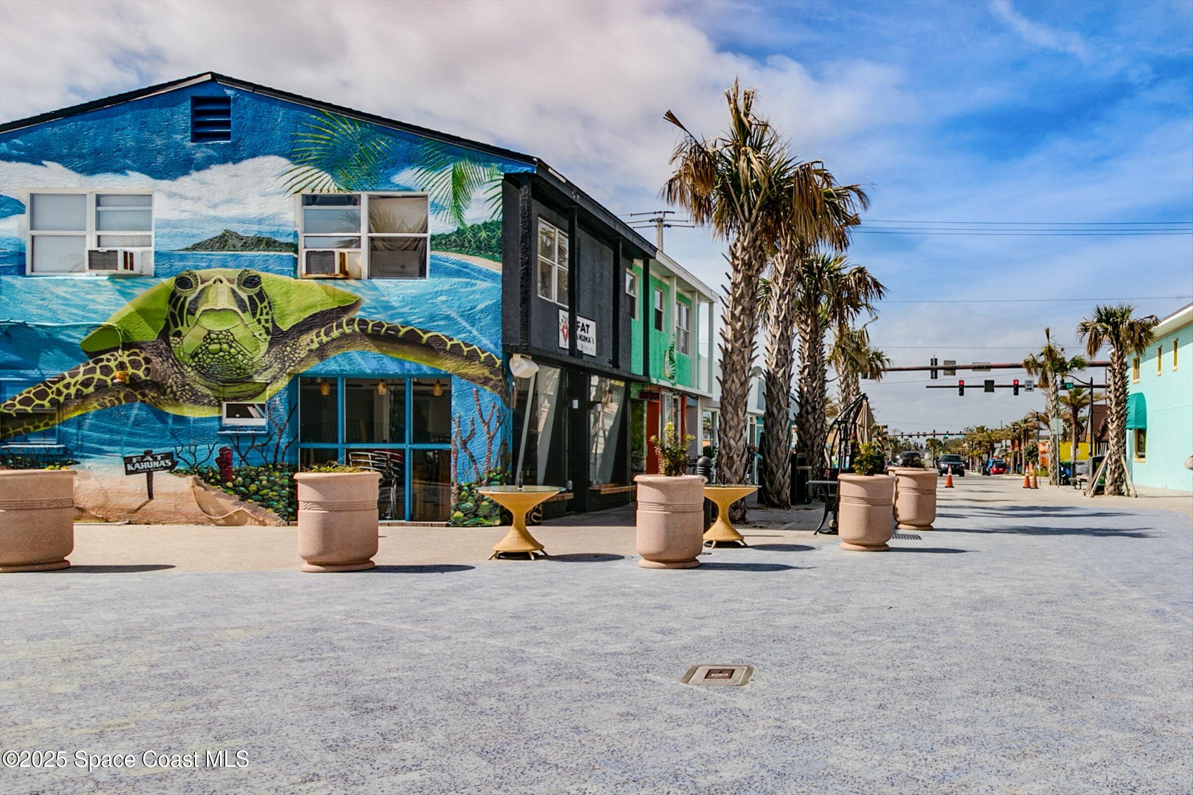 24 Olive Street Cocoa Beach, FL 32931 - Photo 40 of 50 an outdoor space with seating