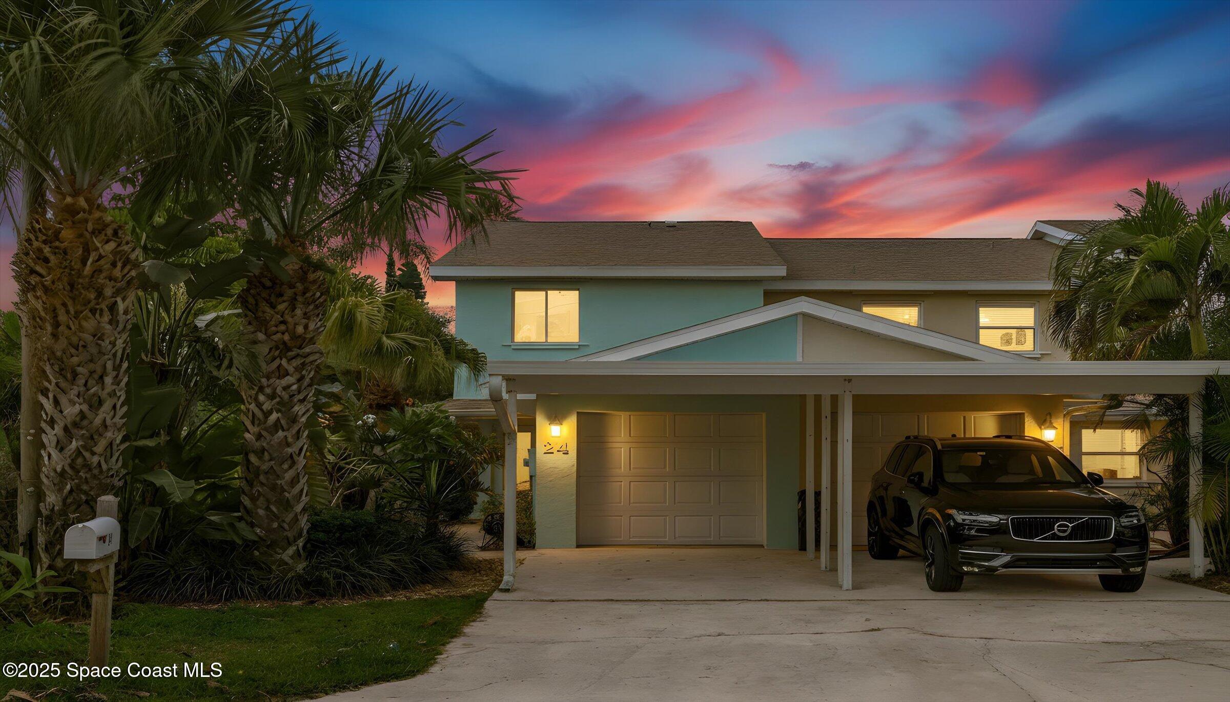 24 Olive Street Cocoa Beach, FL 32931 - Photo 4 of 50 a view of a car park in front of house
