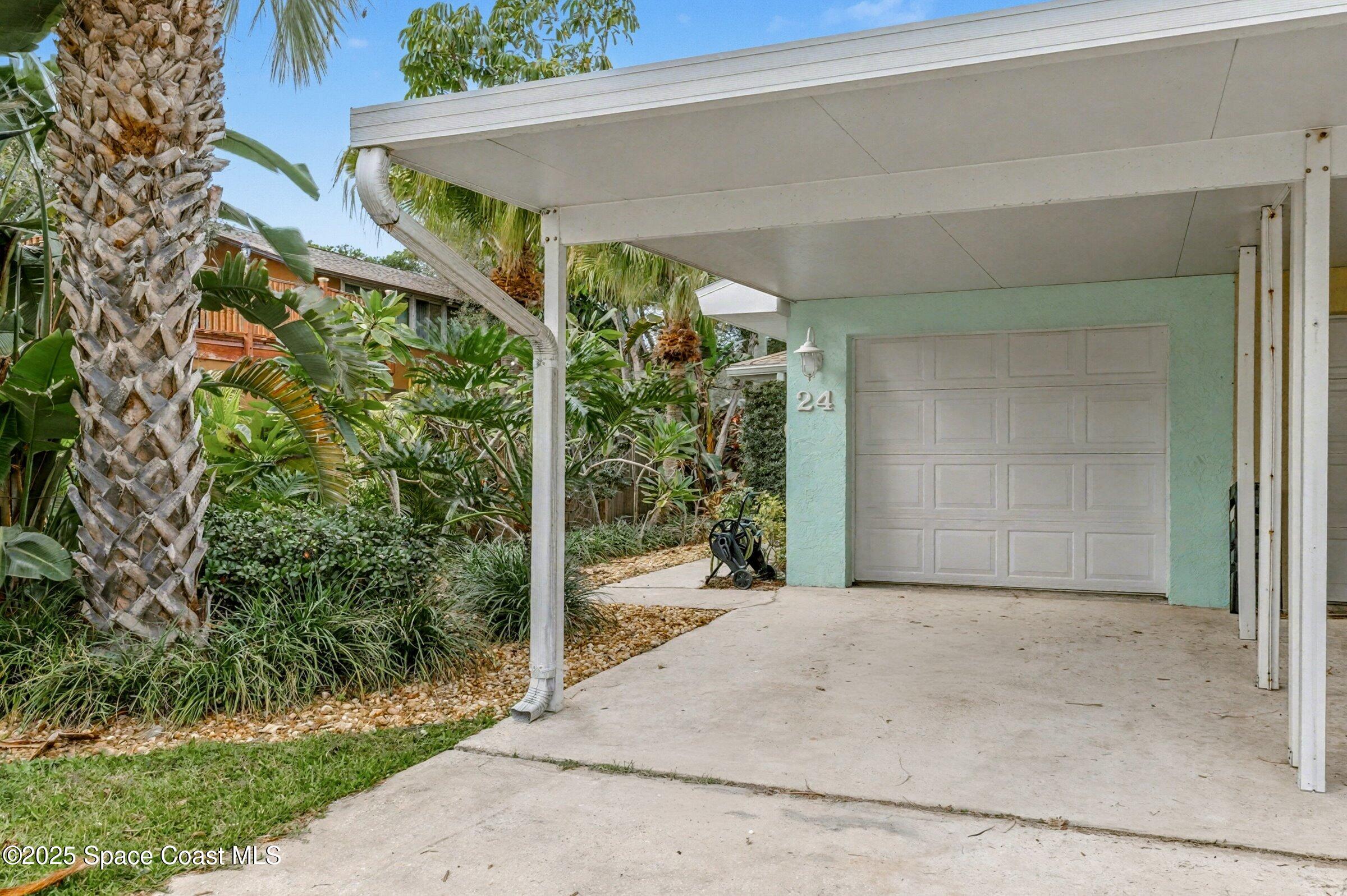 24 Olive Street Cocoa Beach, FL 32931 - Photo 5 of 50 a view of a garage