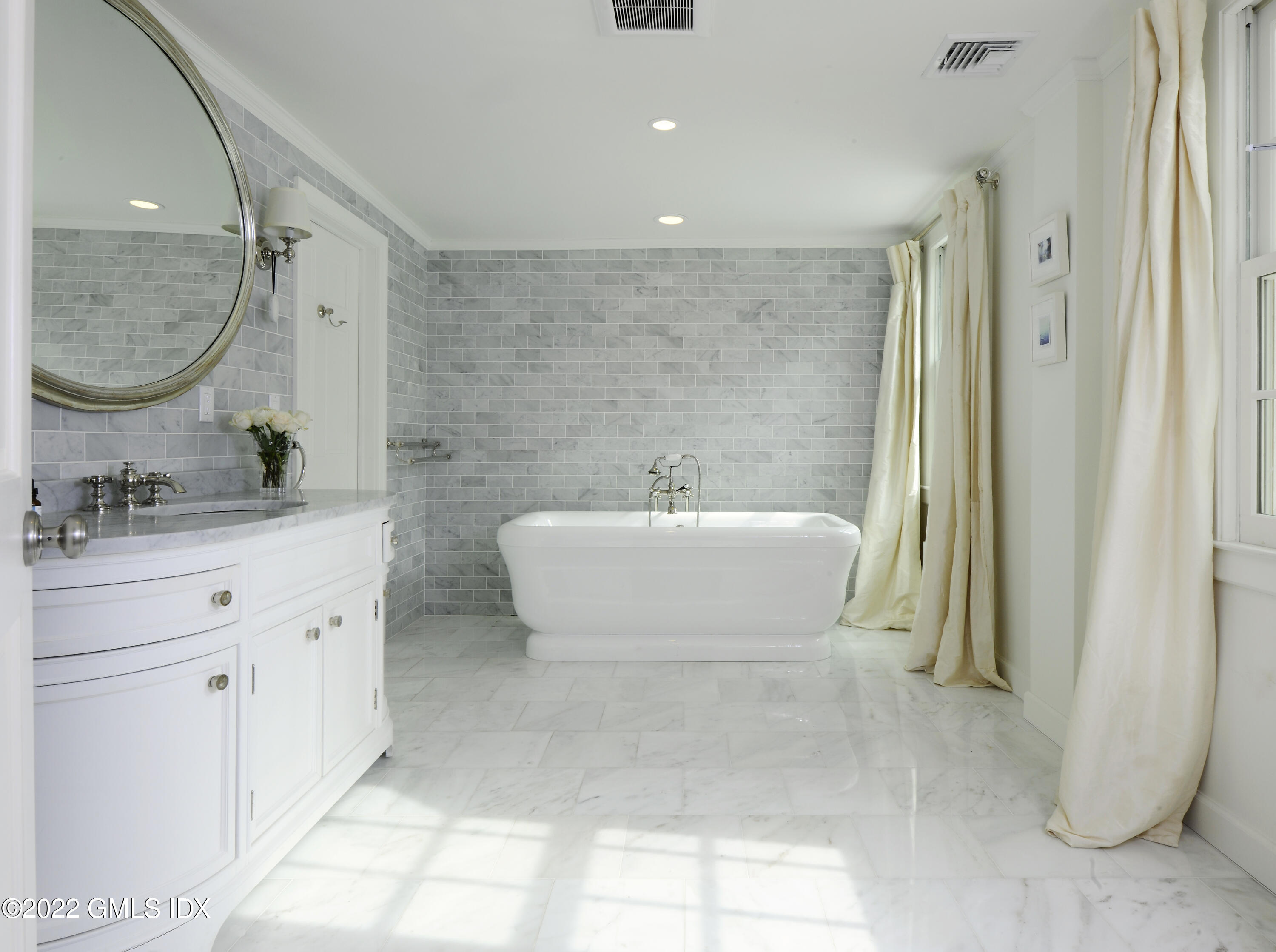 331 Round Hill Road Greenwich, CT 06831 - Photo 11 of 28 a bathroom with a double vanity sink mirror and bathtub