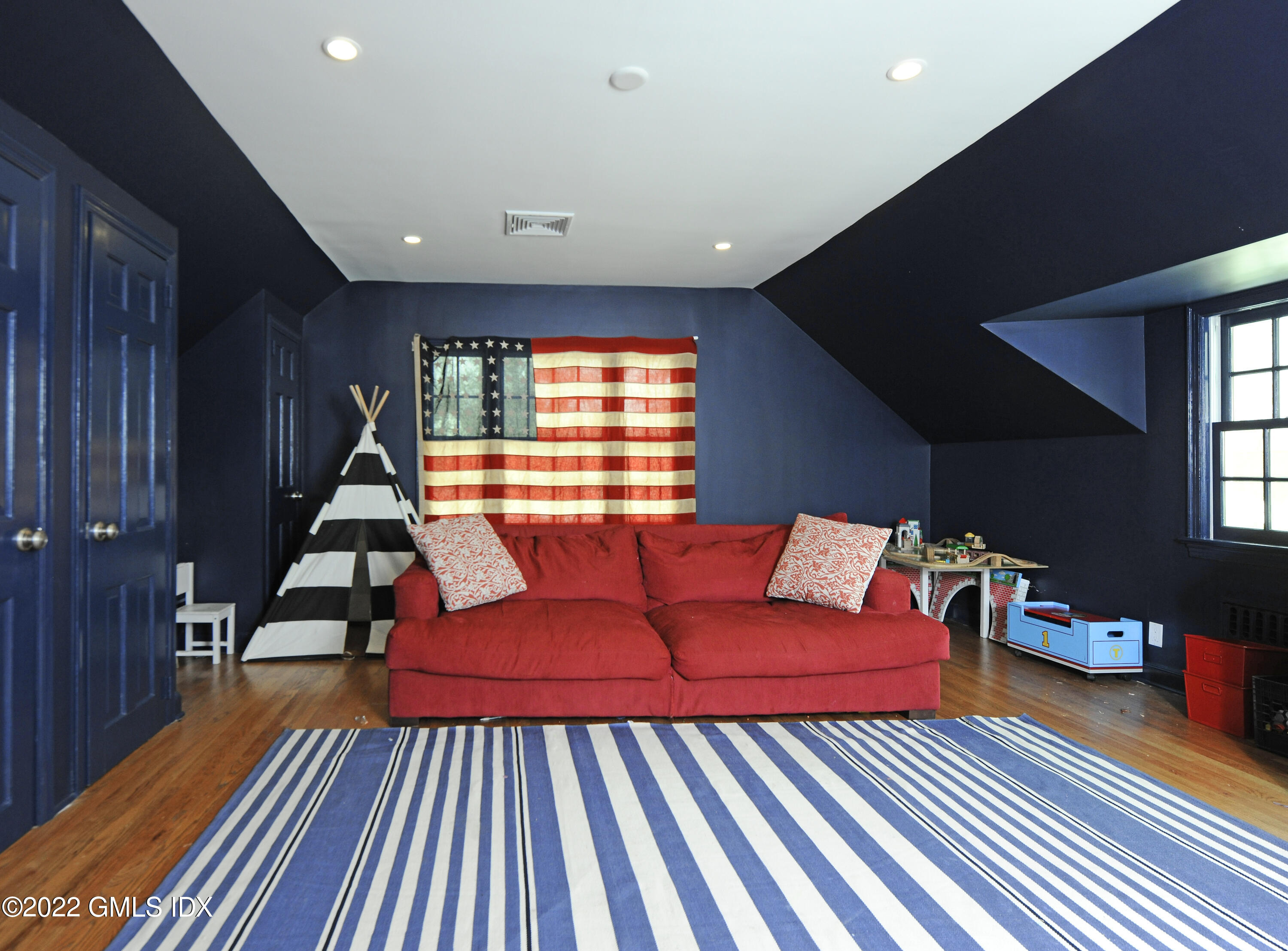 331 Round Hill Road Greenwich, CT 06831 - Photo 18 of 28 a living room with furniture a rug and white walls