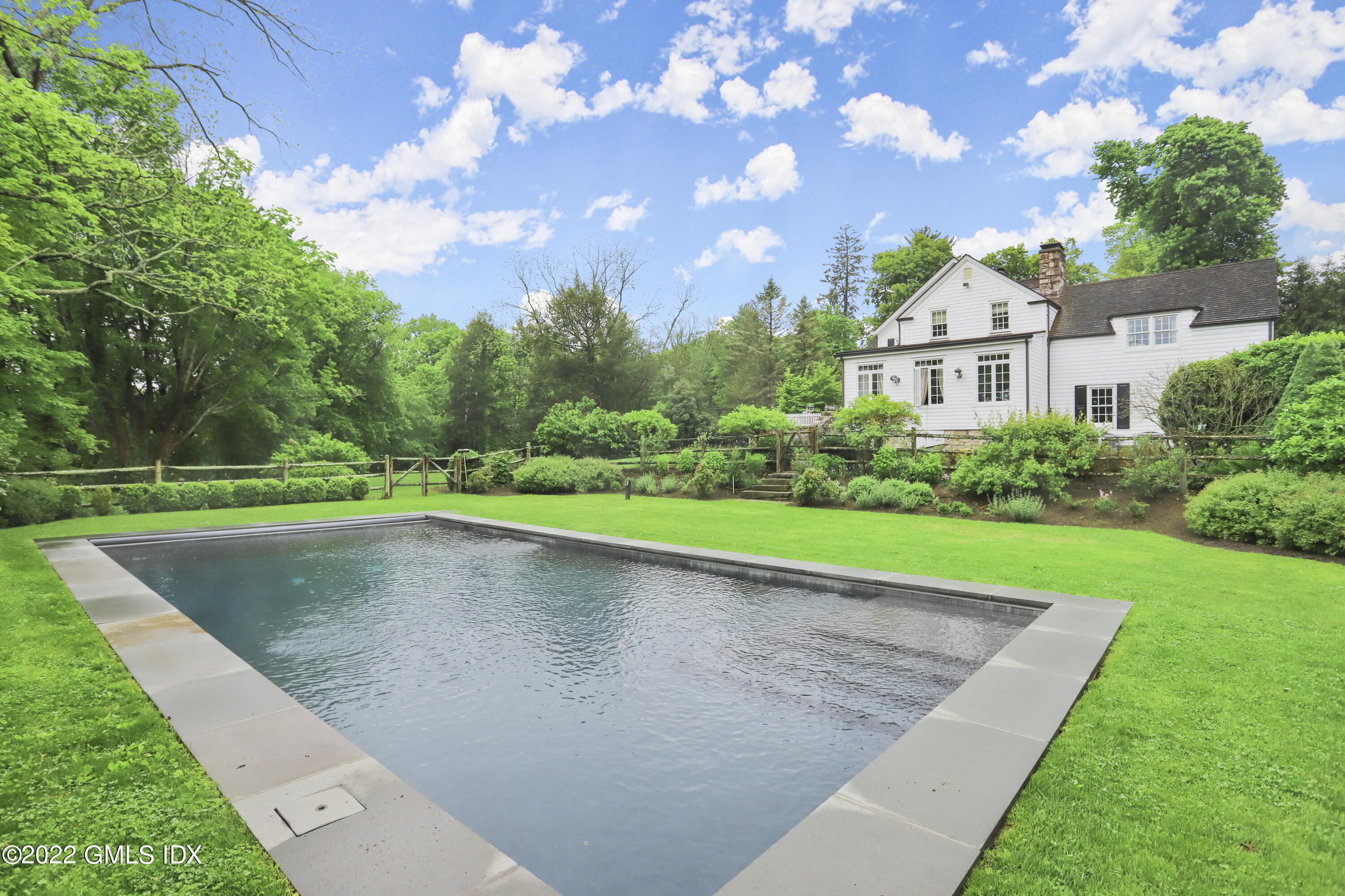 331 Round Hill Road Greenwich, CT 06831 - Photo 20 of 28 a view of a house with a yard