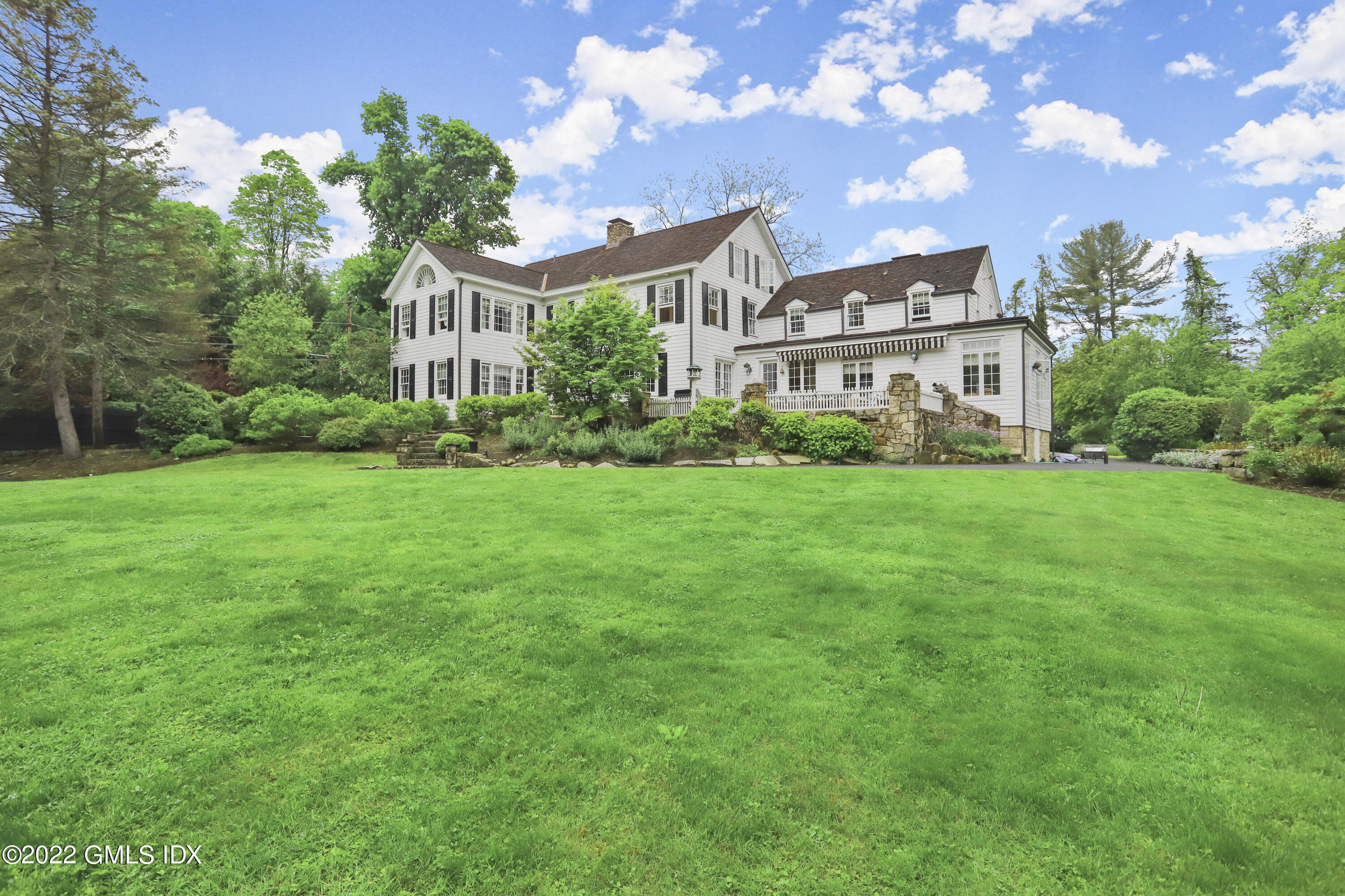 331 Round Hill Road Greenwich, CT 06831 - Photo 21 of 28 a view of a building with garden