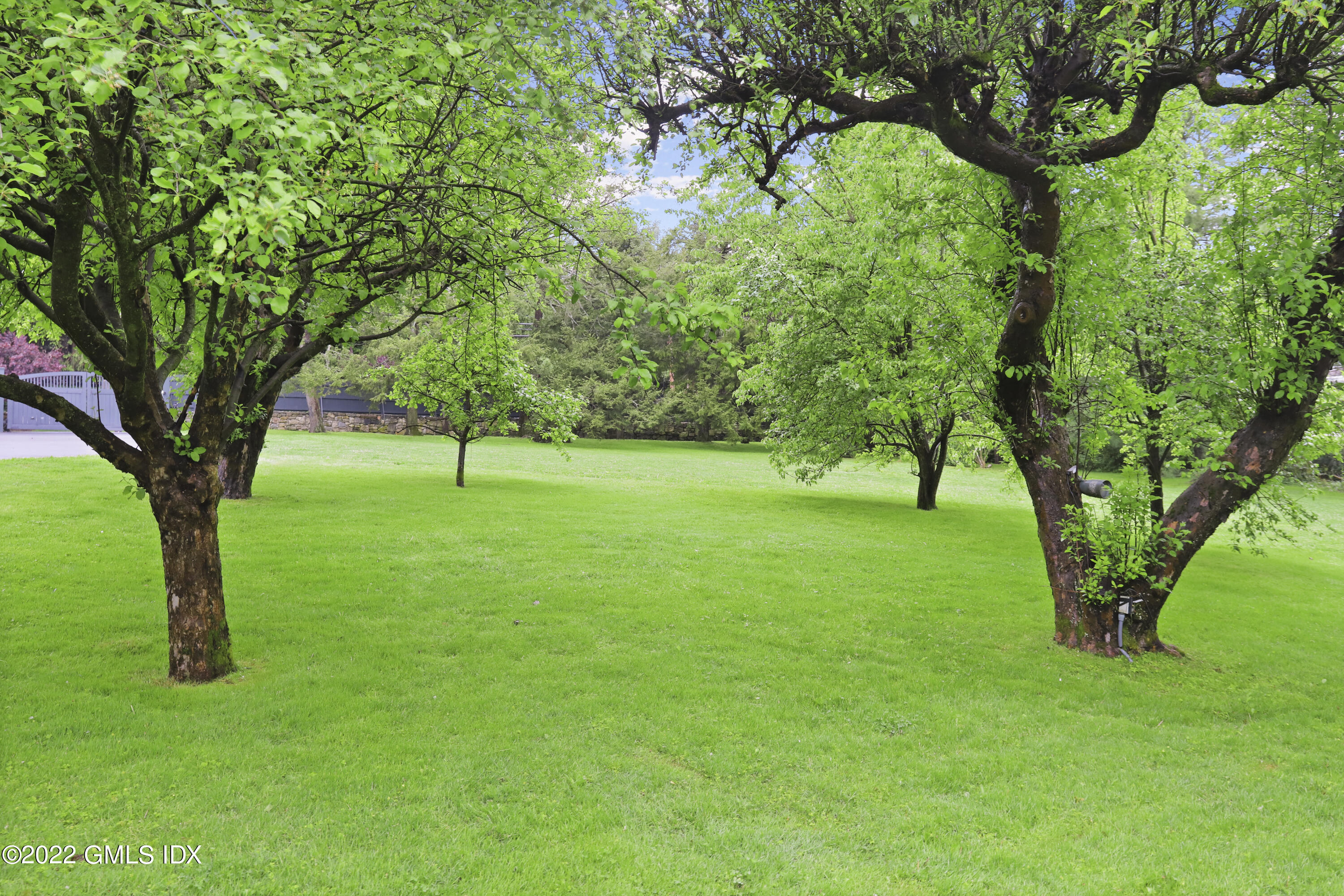 331 Round Hill Road Greenwich, CT 06831 - Photo 23 of 28 a view of grassy field with benches