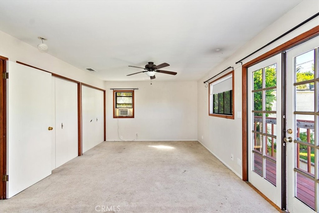 6027 West 76th Street Los Angeles, CA 90045 - Photo 23 of 36 Spacious upstairs bedroom with walk-in closet. French Doors lead to the balcony overlooking the backyard.