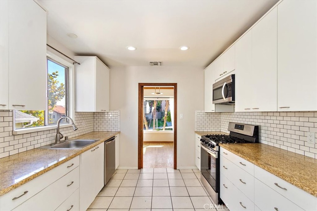 6027 West 76th Street Los Angeles, CA 90045 - Photo 8 of 36 Spacious Kitchen off of Formal Dining Area
