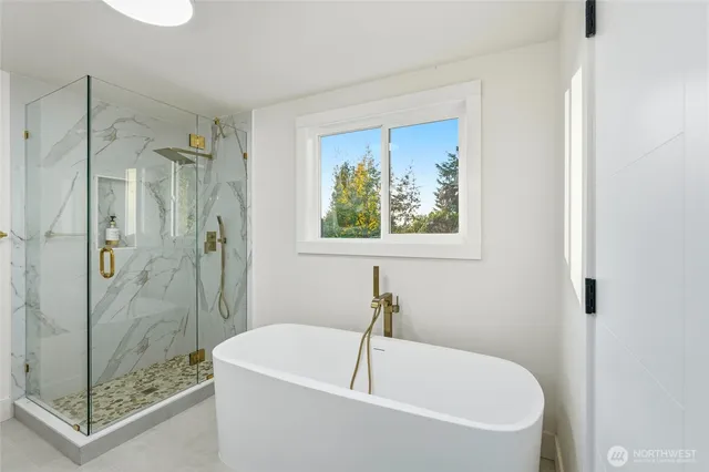 a bedroom with a large bed and a table