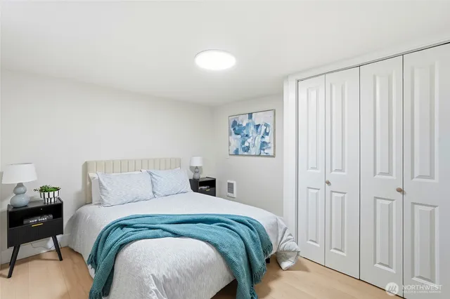 a bedroom with a bed and a cabinets