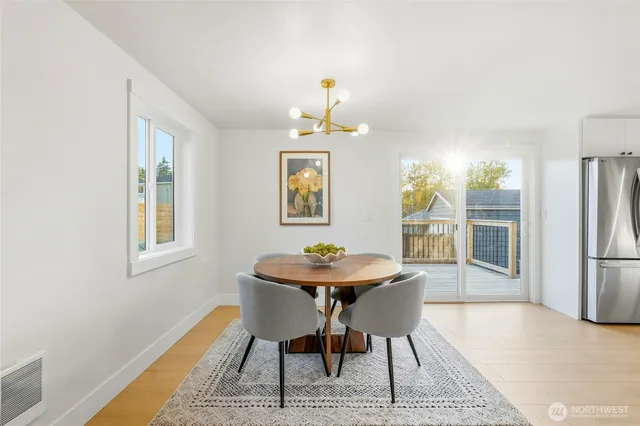 a dining room with furniture and window