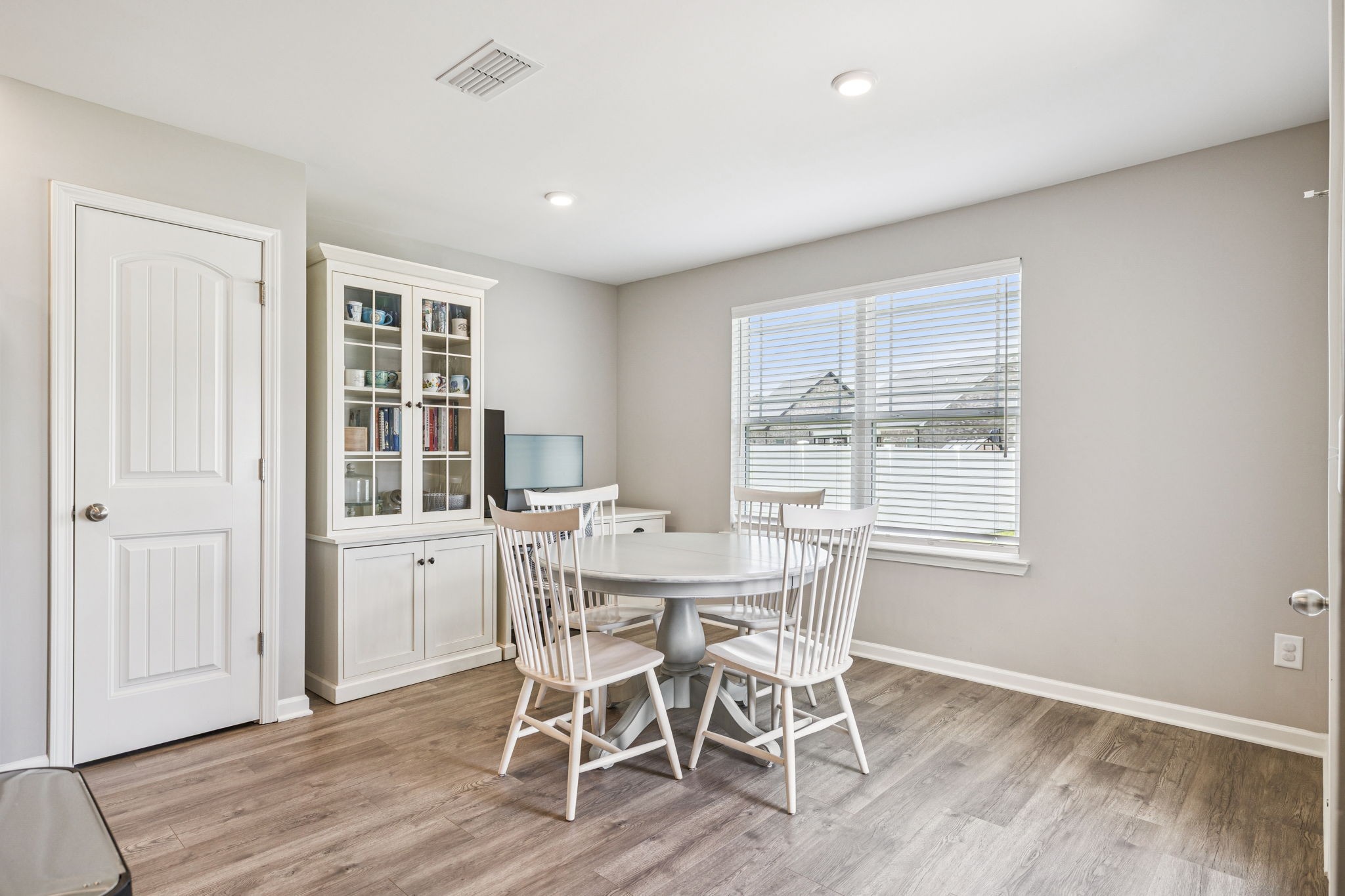 225 Thorpe Dr Spring Hill Spring Hill, TN 37174 - Photo 12 of 33 a view of a dining room with furniture and wooden floor