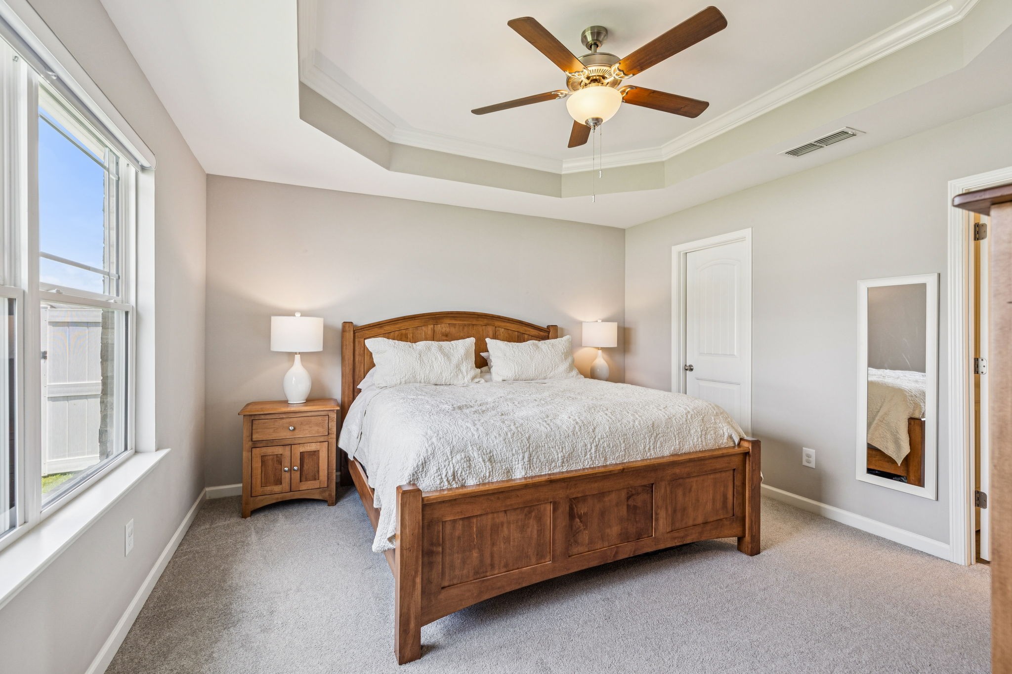 225 Thorpe Dr Spring Hill Spring Hill, TN 37174 - Photo 18 of 33 a bedroom with a bed chandelier and a window