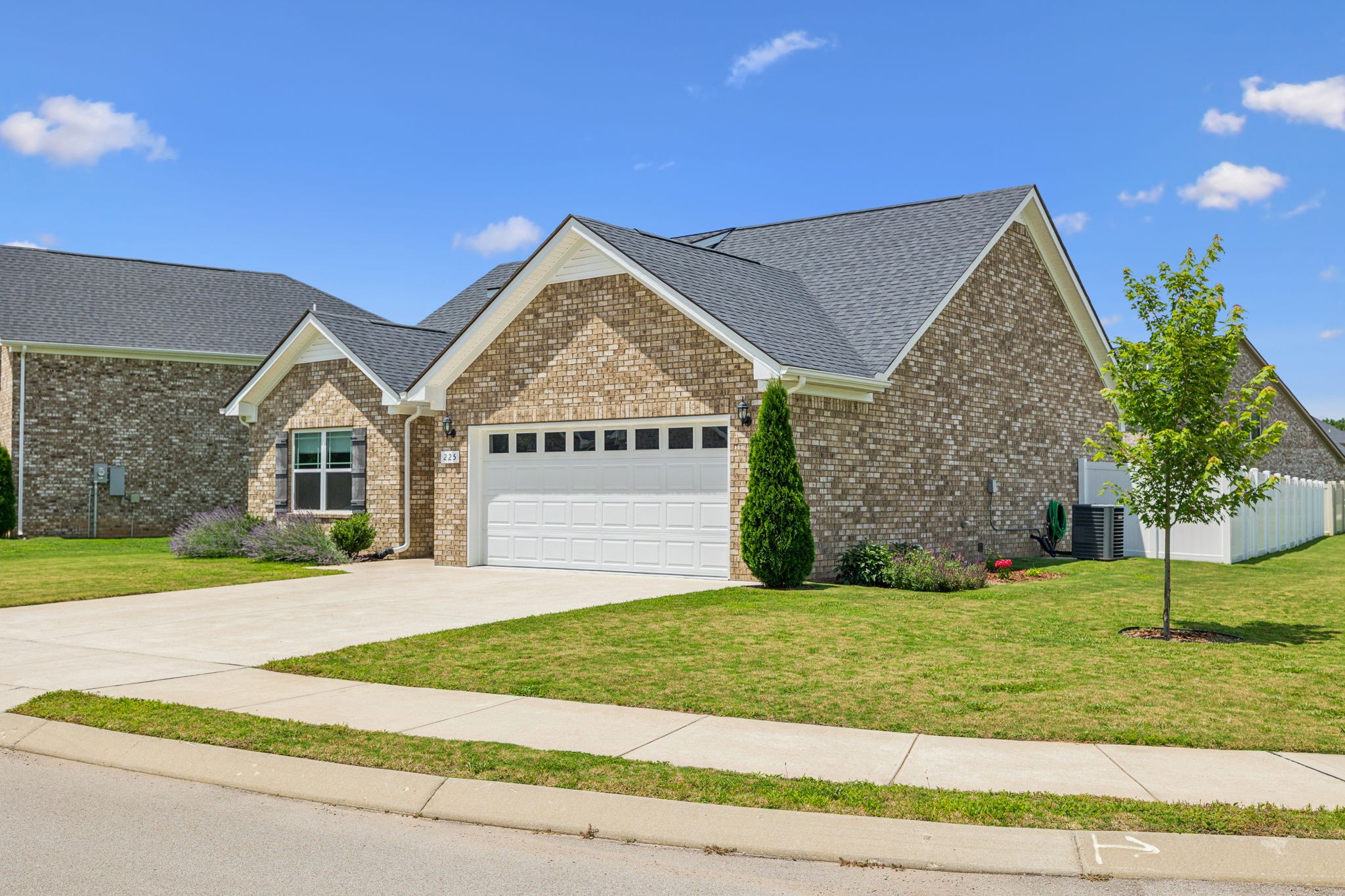 225 Thorpe Dr Spring Hill Spring Hill, TN 37174 - Photo 2 of 33 a view of a house with a yard and large tree