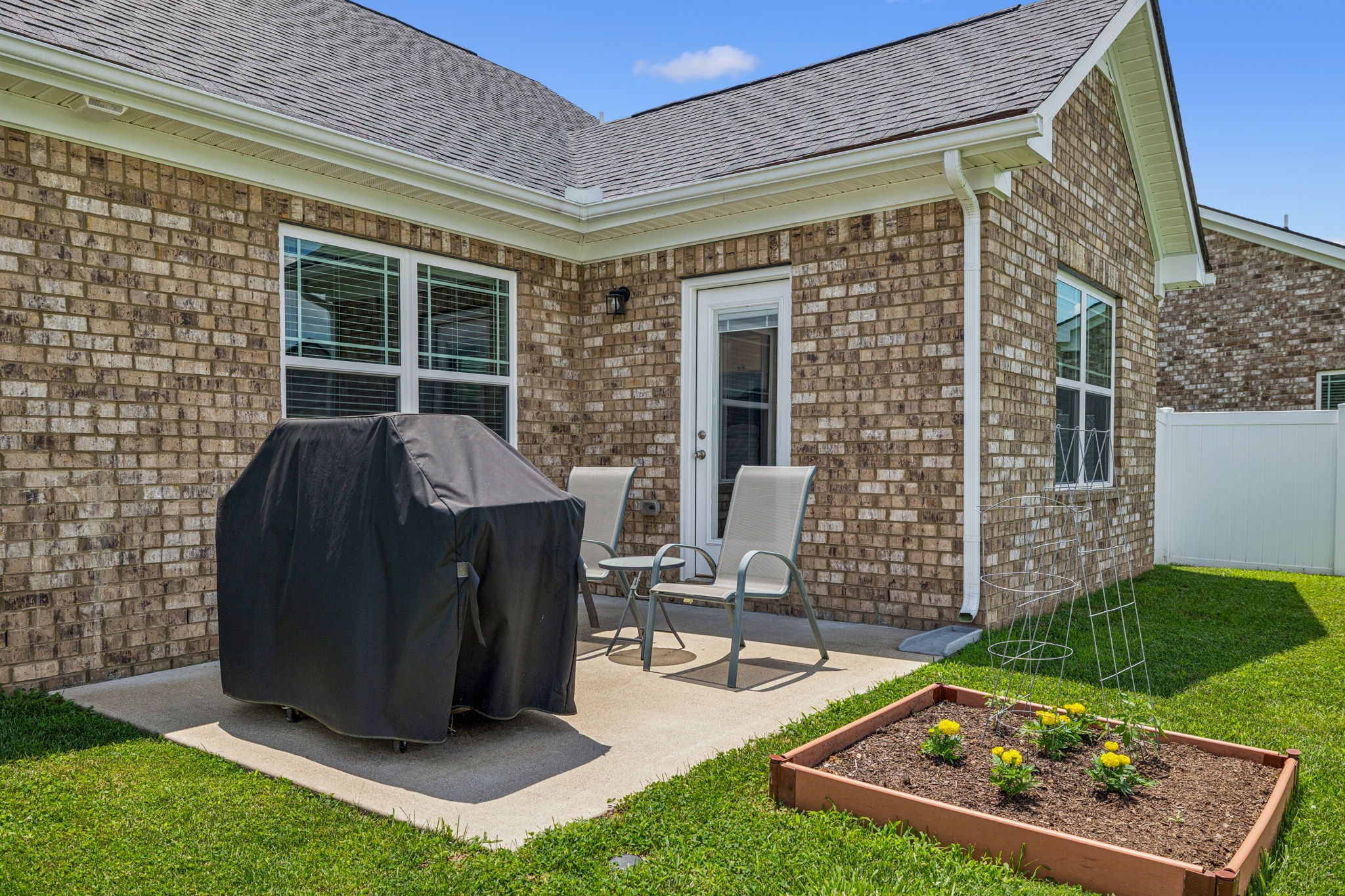 225 Thorpe Dr Spring Hill Spring Hill, TN 37174 - Photo 26 of 33 a view of a chairs and table in the back yard of the house