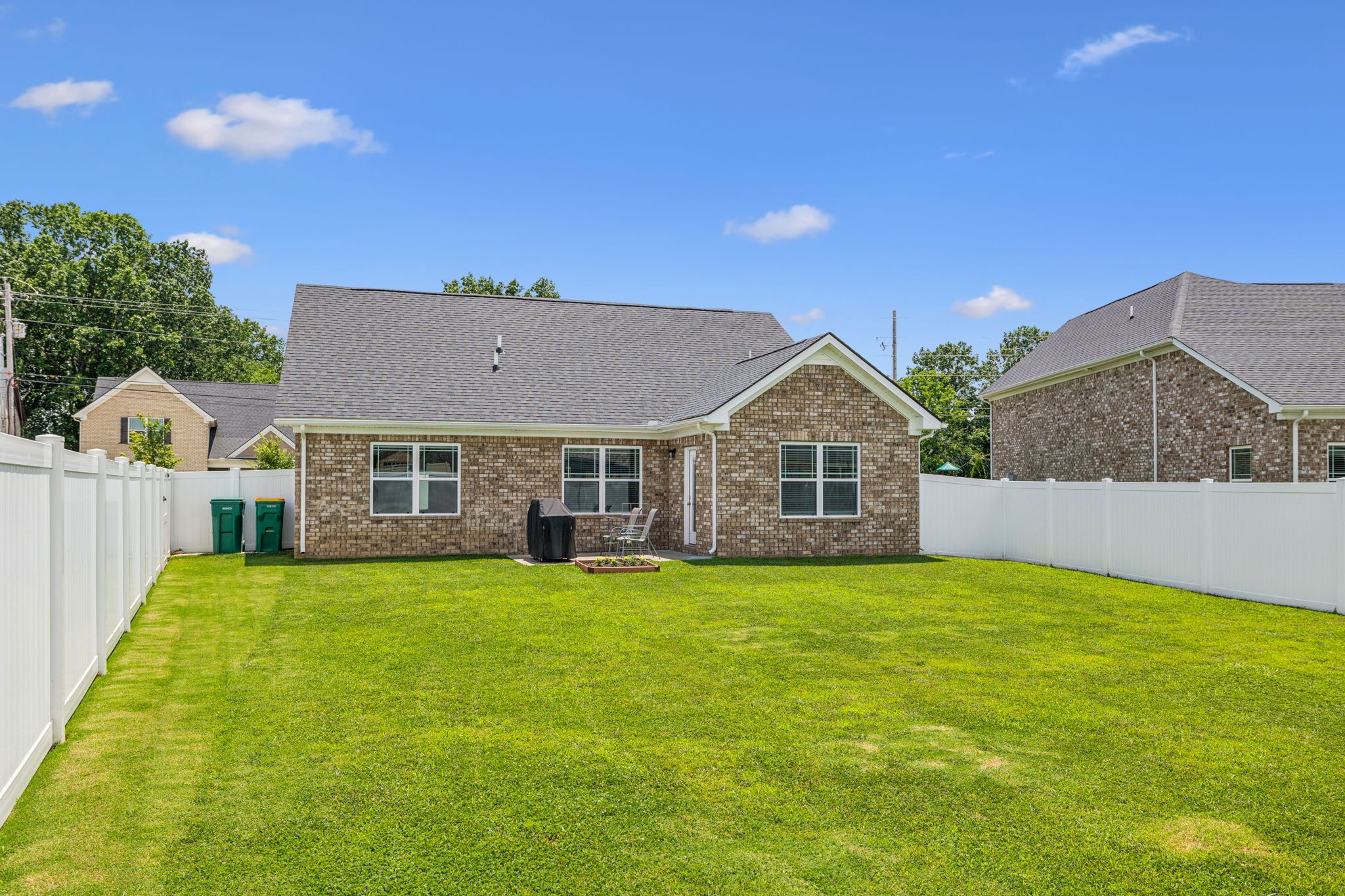 225 Thorpe Dr Spring Hill Spring Hill, TN 37174 - Photo 30 of 33 a view of a house with a big yard and large trees