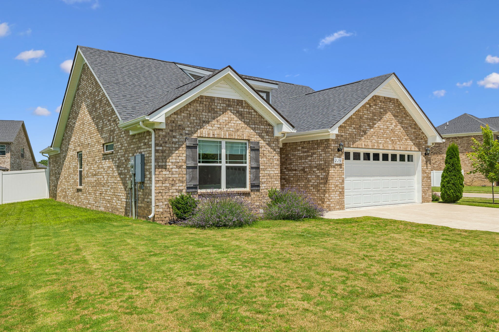 225 Thorpe Dr Spring Hill Spring Hill, TN 37174 - Photo 3 of 33 a front view of a house with a yard and garage