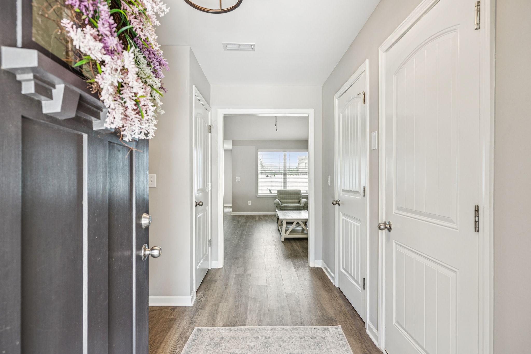 225 Thorpe Dr Spring Hill Spring Hill, TN 37174 - Photo 5 of 33 a view of a hallway with wooden floor and staircase