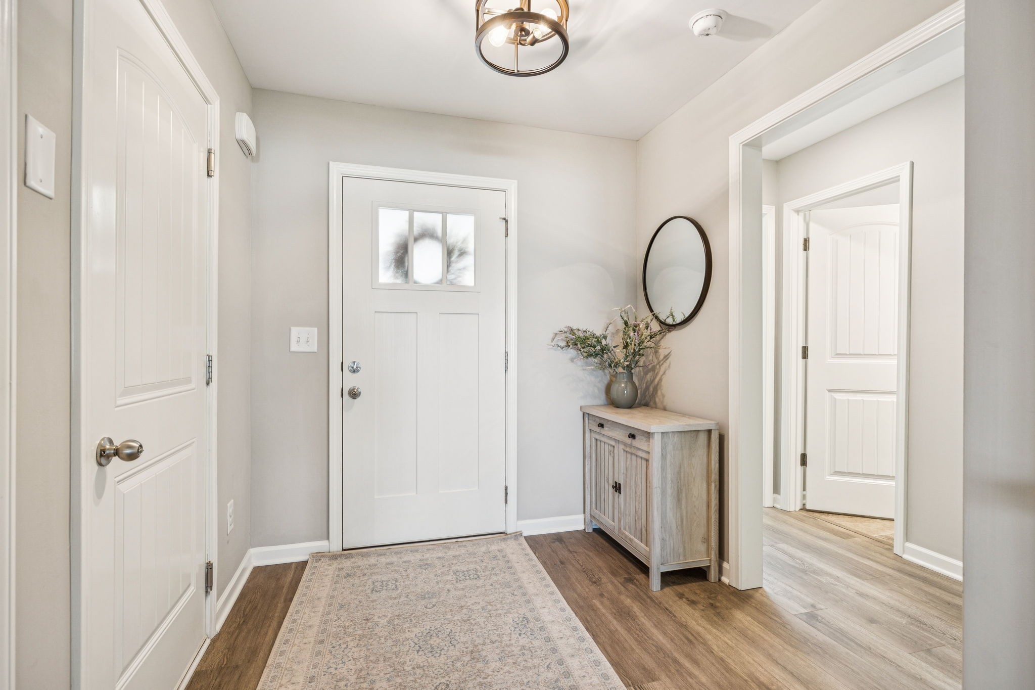 225 Thorpe Dr Spring Hill Spring Hill, TN 37174 - Photo 6 of 33 a view of a room with wooden floor and white walls