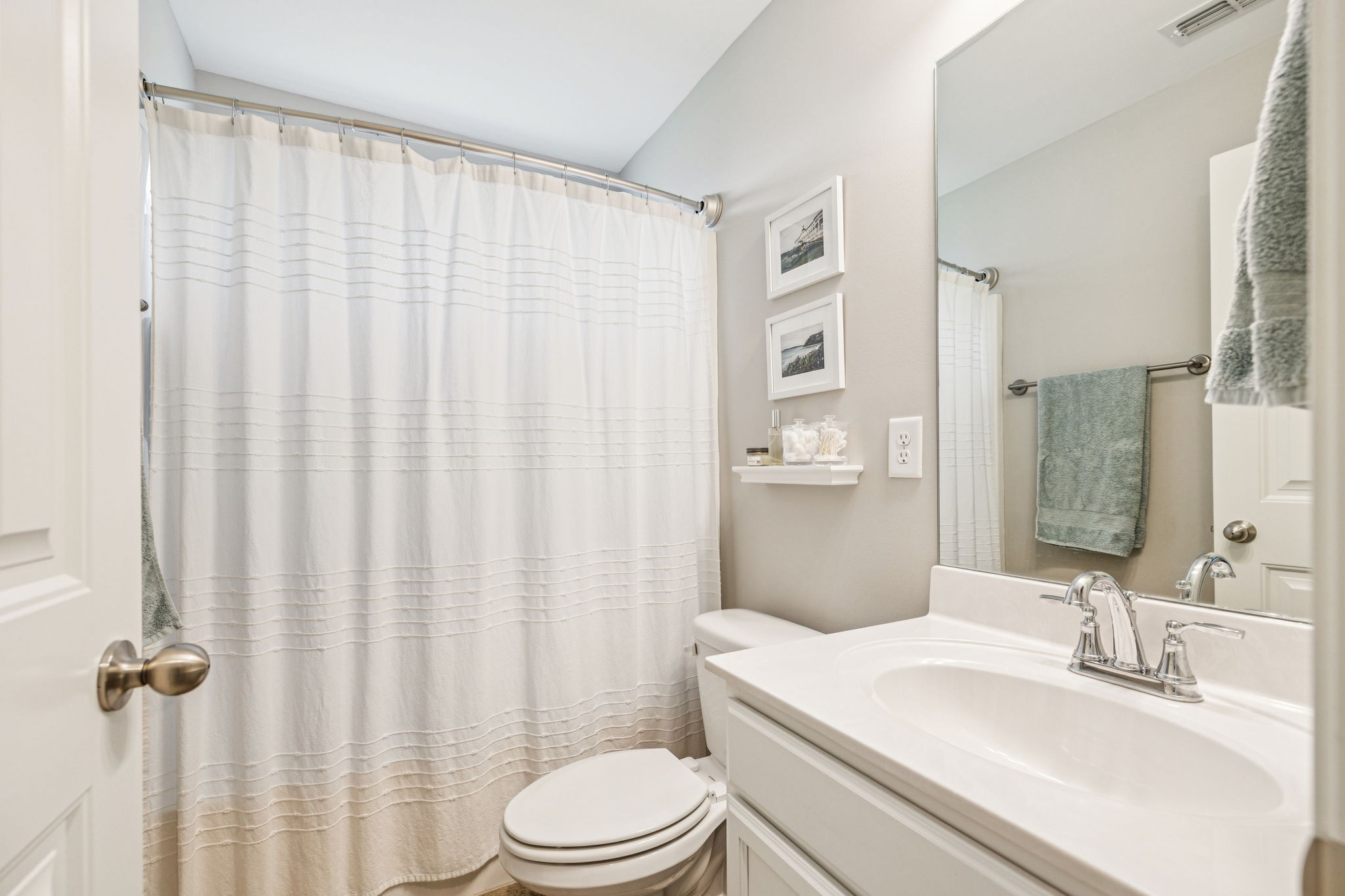 225 Thorpe Dr Spring Hill Spring Hill, TN 37174 - Photo 8 of 33 a bathroom with a sink a toilet and shower curtain