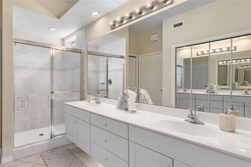 2370 Hidden Lake Court, Unit 8301 Naples, FL 34112 - Photo 12 of 21 Primary bathroom