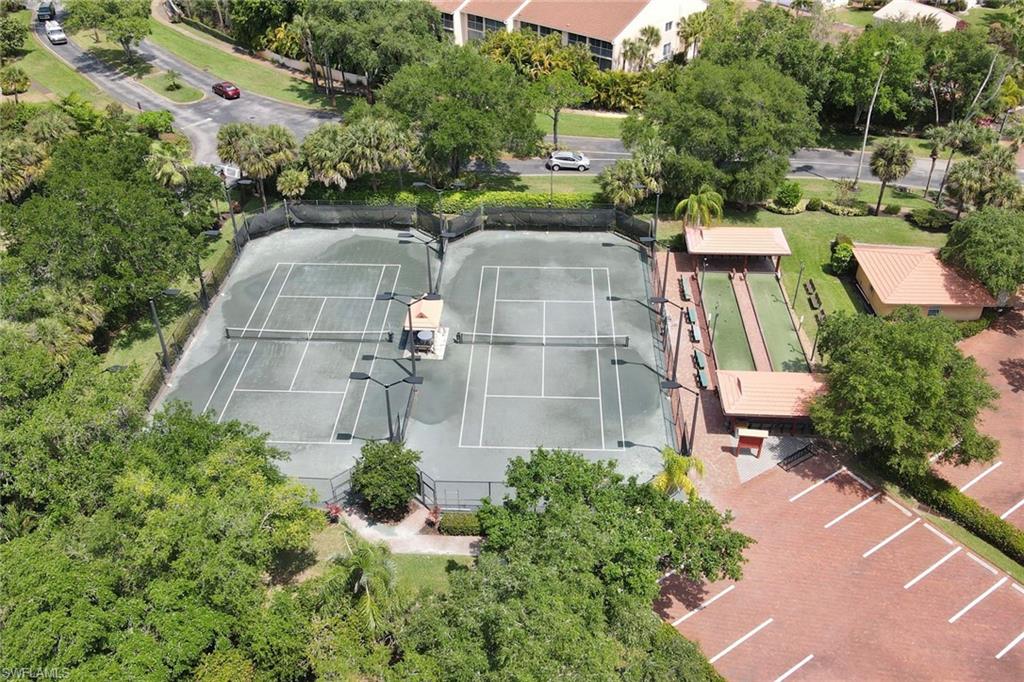 2370 Hidden Lake Court, Unit 8301 Naples, FL 34112 - Photo 21 of 21 Drone / aerial view of tennis courts