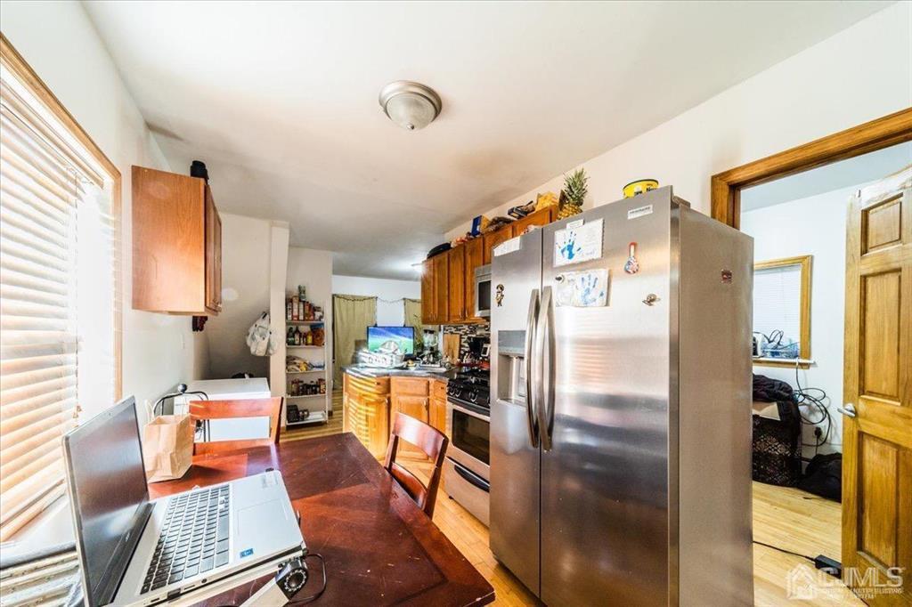 28 Union Street Carteret, NJ 07008 - Photo 11 of 25 a living room with furniture and a flat screen tv