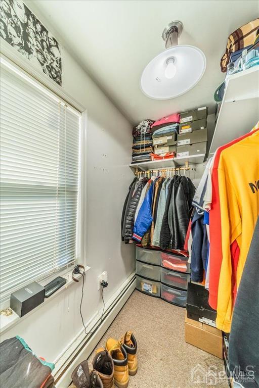 28 Union Street Carteret, NJ 07008 - Photo 13 of 25 a bathroom with a sink and a mirror