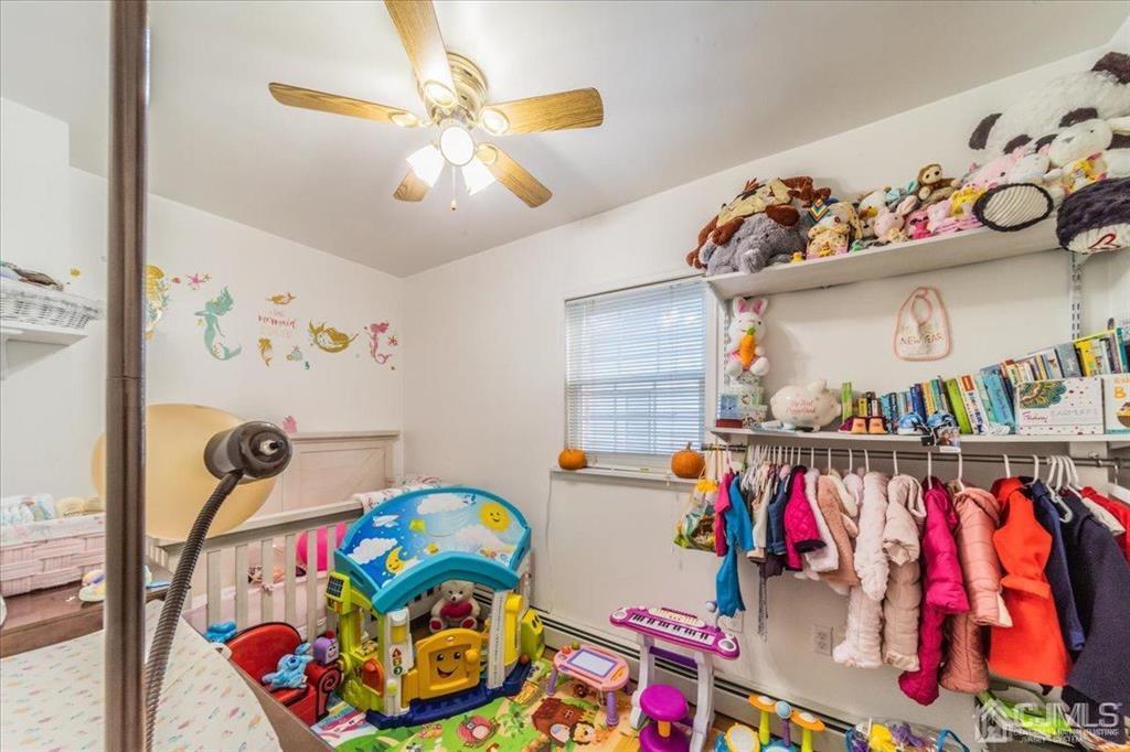 28 Union Street Carteret, NJ 07008 - Photo 14 of 25 a view of kids room with toys and a fan