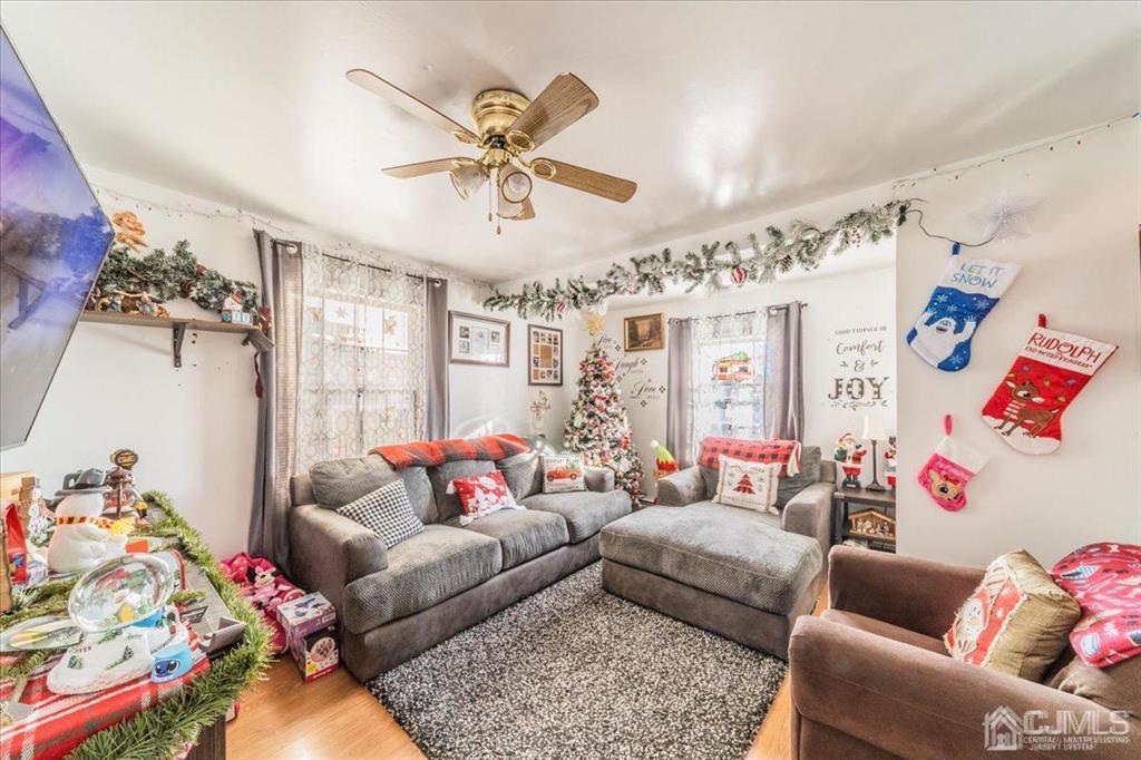 28 Union Street Carteret, NJ 07008 - Photo 15 of 25 a living room with furniture and a chandelier
