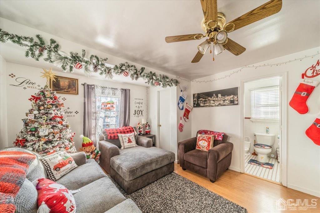 28 Union Street Carteret, NJ 07008 - Photo 16 of 25 a living room with furniture and flowers
