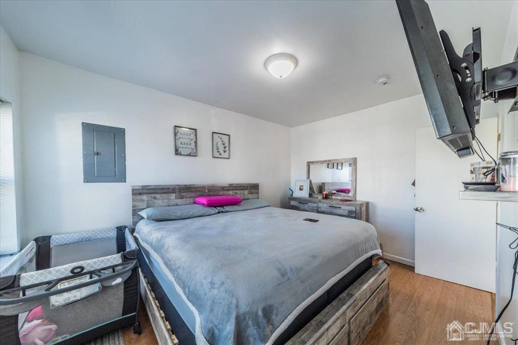 28 Union Street Carteret, NJ 07008 - Photo 10 of 25 a room with a bed and a view of kitchen
