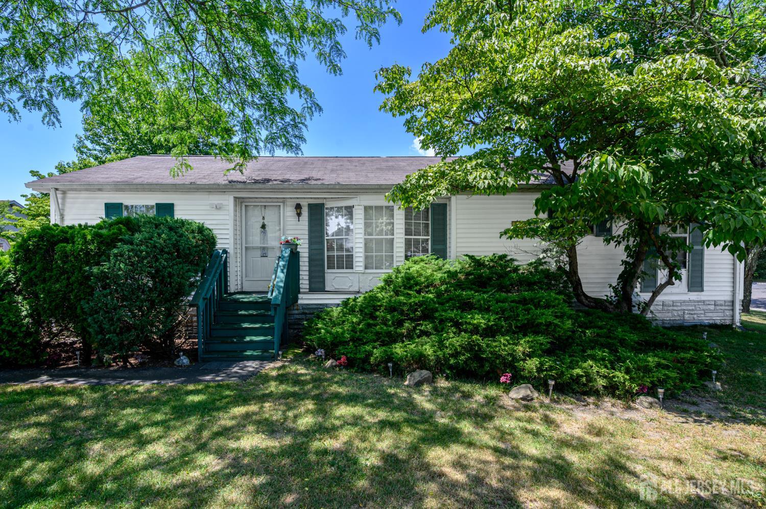 8 Snow Chief Court Howell, NJ 07731 - Photo 1 of 26 a view of house with a yard and potted plants