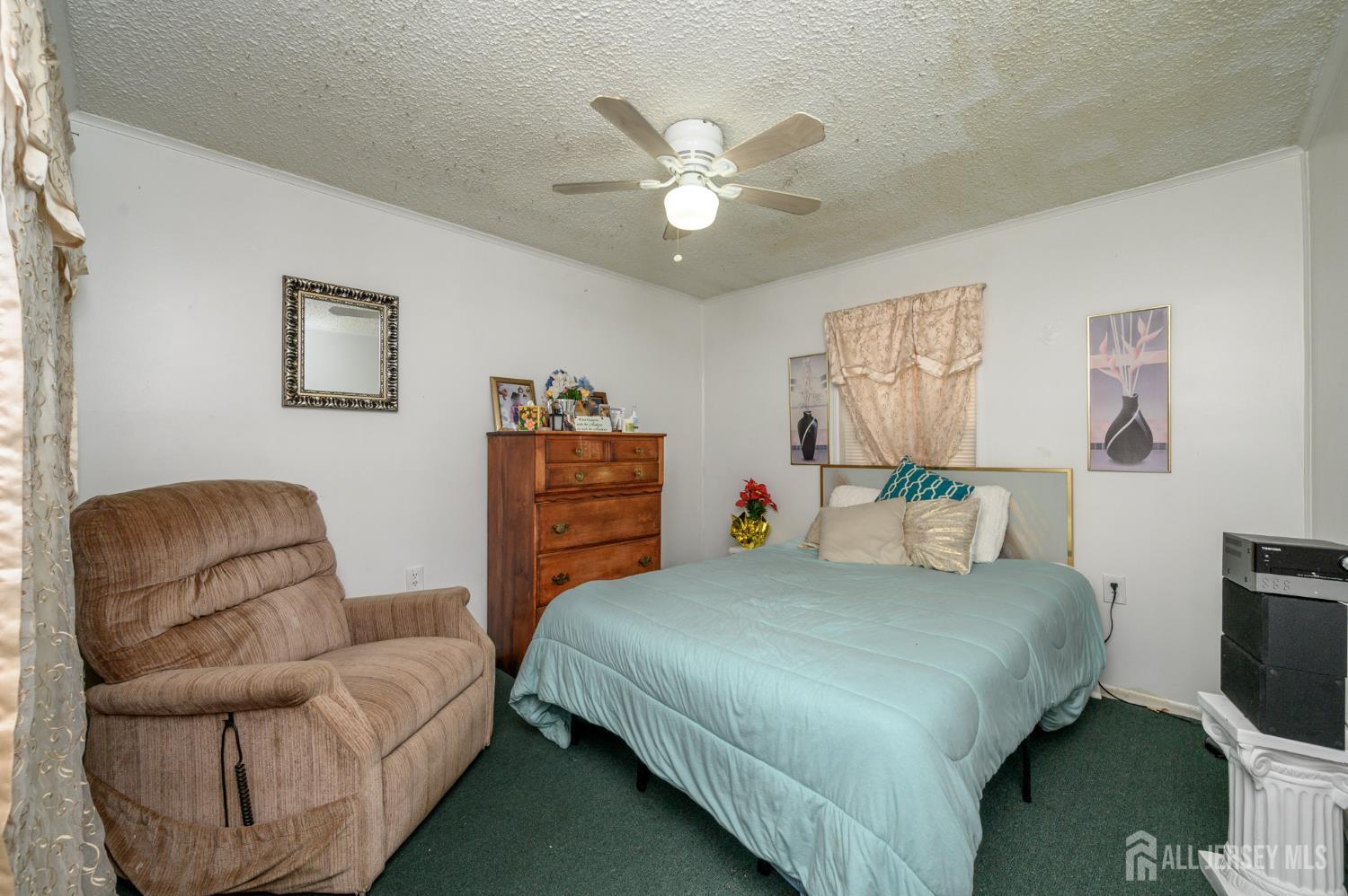 8 Snow Chief Court Howell, NJ 07731 - Photo 13 of 26 a bedroom with a bed couches and dresser