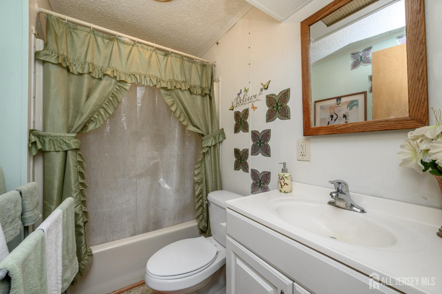 8 Snow Chief Court Howell, NJ 07731 - Photo 15 of 26 a bathroom with a sink a toilet and shower