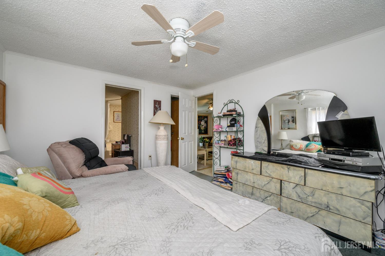 8 Snow Chief Court Howell, NJ 07731 - Photo 19 of 26 a bedroom with a bed window and a flat screen tv