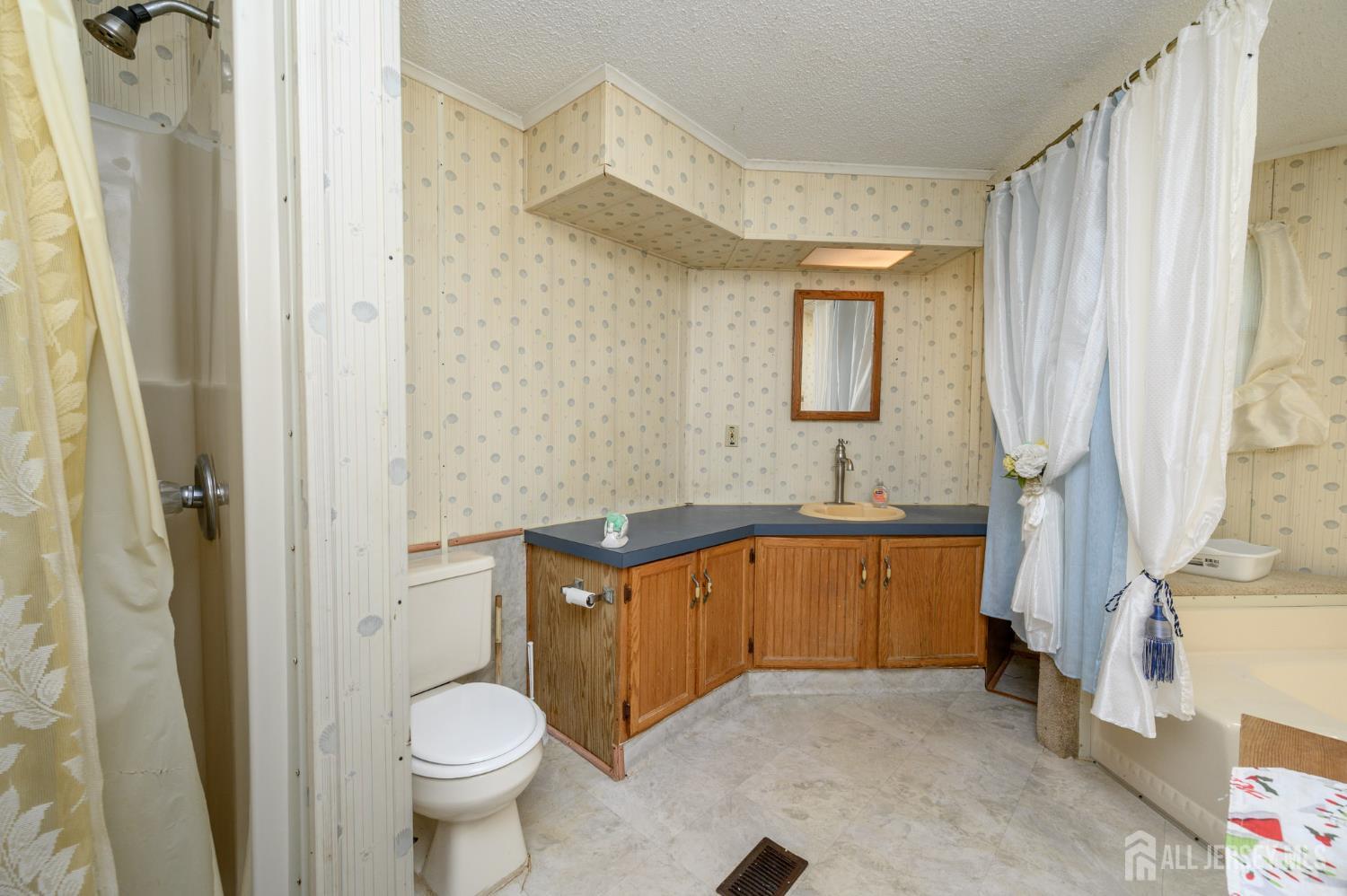 8 Snow Chief Court Howell, NJ 07731 - Photo 20 of 26 a bathroom with a granite countertop toilet sink and mirror