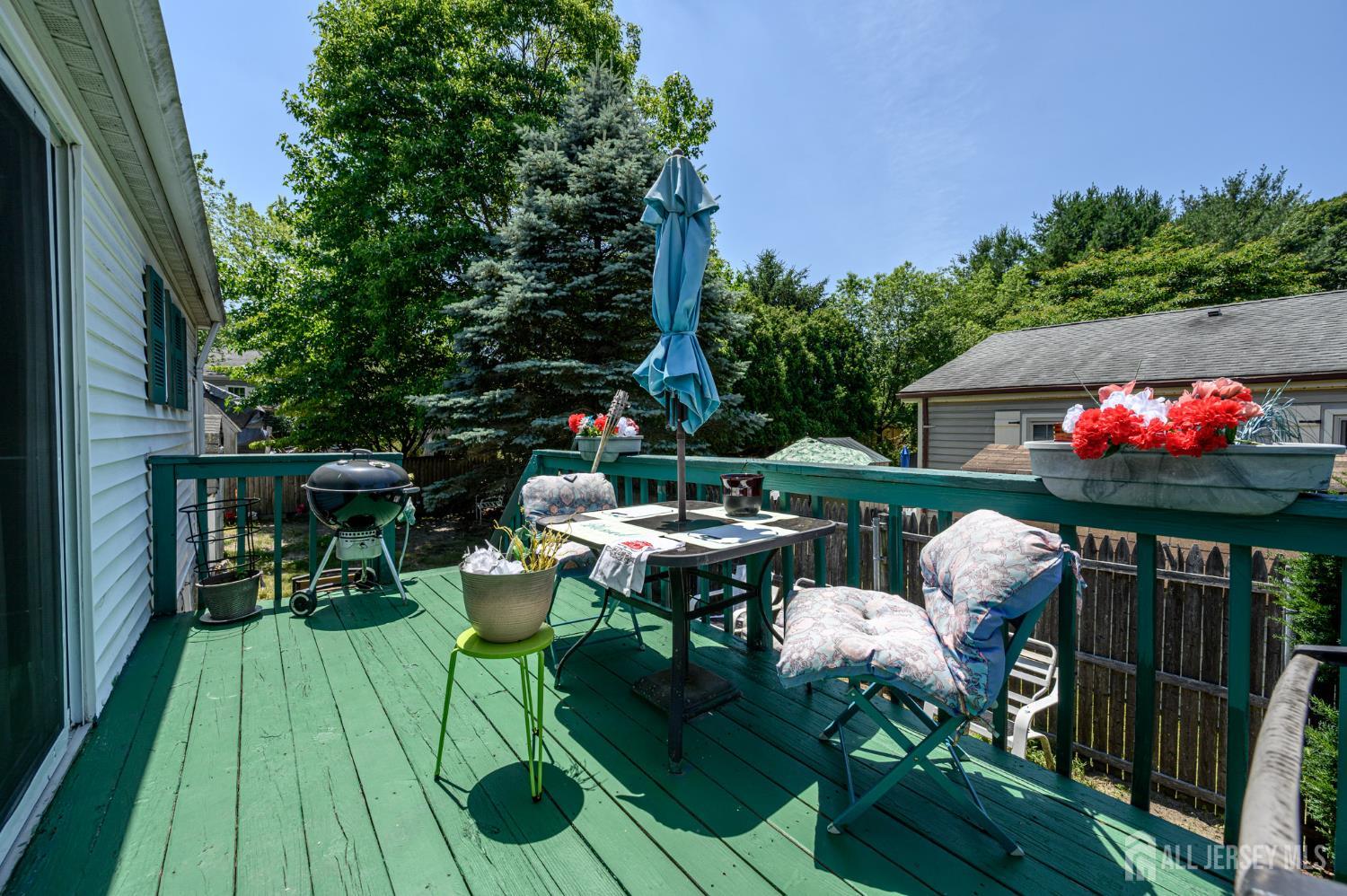 8 Snow Chief Court Howell, NJ 07731 - Photo 22 of 26 a view of a dinning tables and chairs in a patio