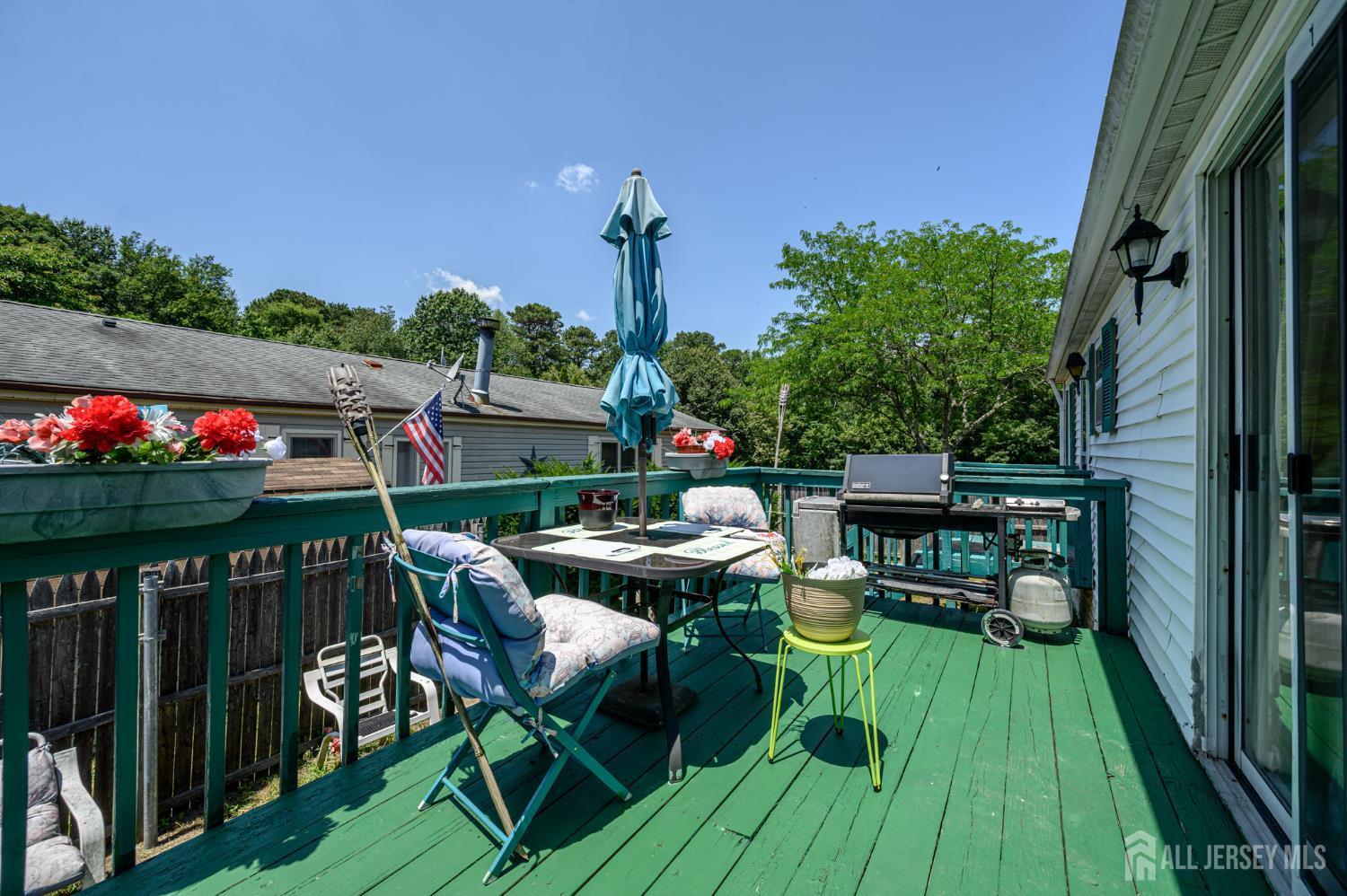 8 Snow Chief Court Howell, NJ 07731 - Photo 23 of 26 a view of a chairs and table in patio with a yard