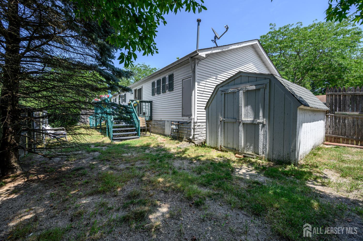 8 Snow Chief Court Howell, NJ 07731 - Photo 24 of 26 a view of backyard of house with green space